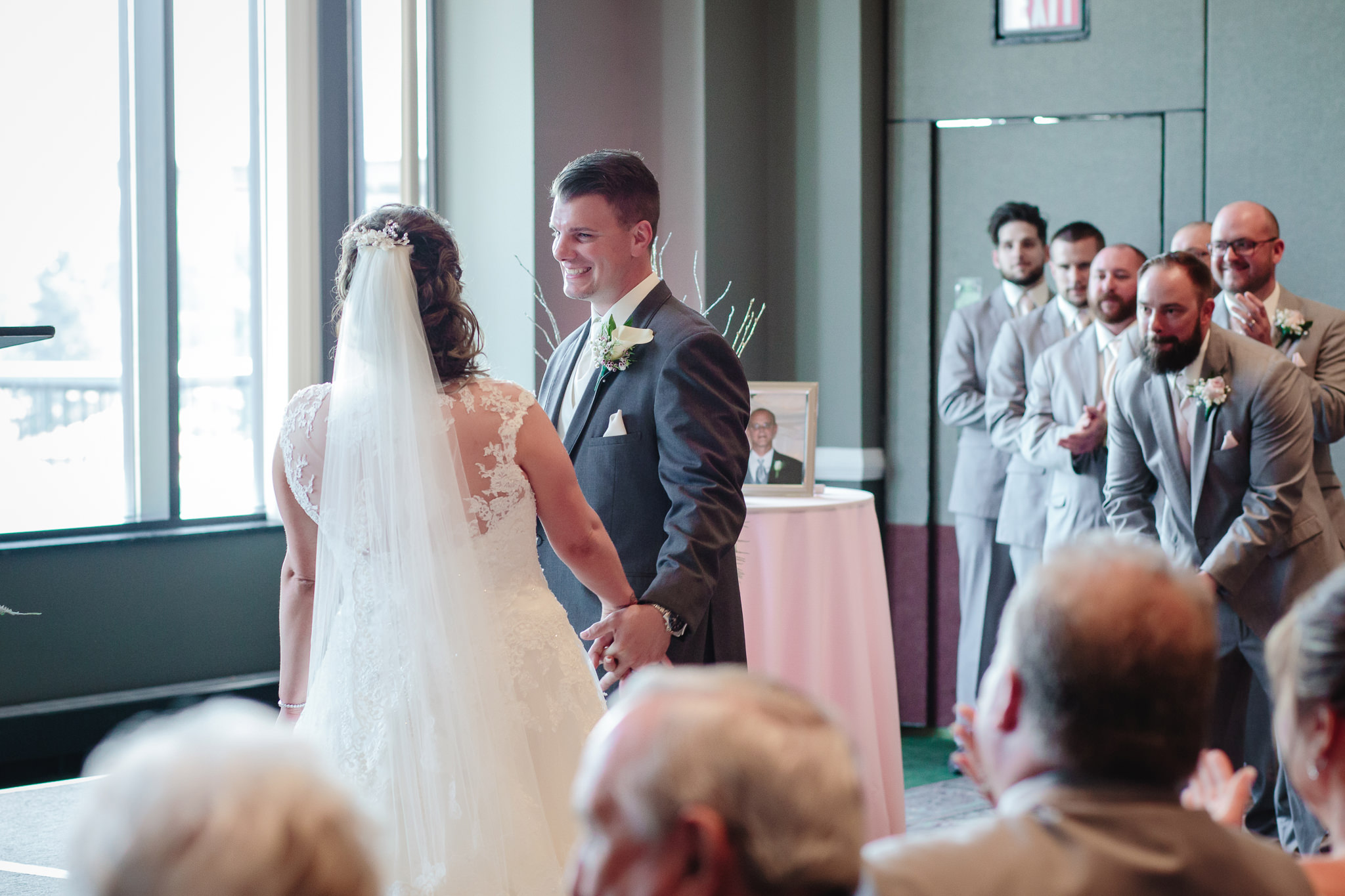 Groom smiles at his bride at their Chestnut Ridge Golf Resort wedding