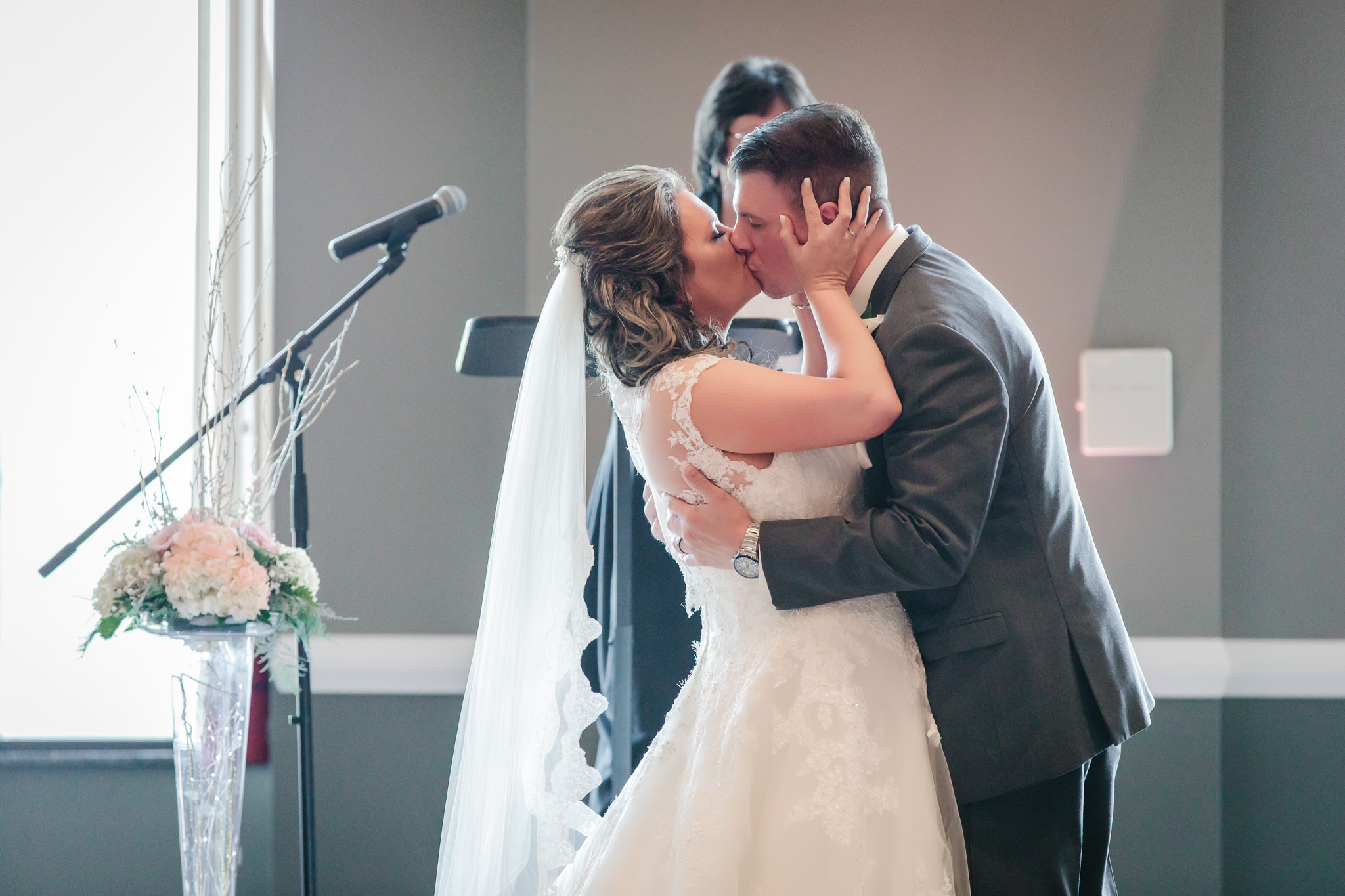 Bride and groom's first kiss at Chestnut Ridge Golf Resort