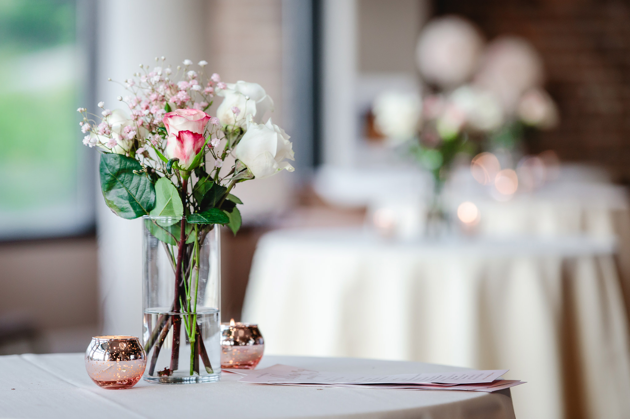 Floral centerpieces at cocktail hour at Chestnut Ridge Golf Resort wedding