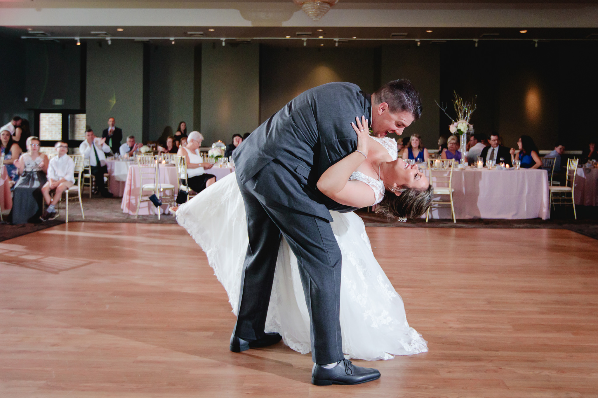 Groom dips the bride during their first dance at Chestnut Ridge Golf Resort