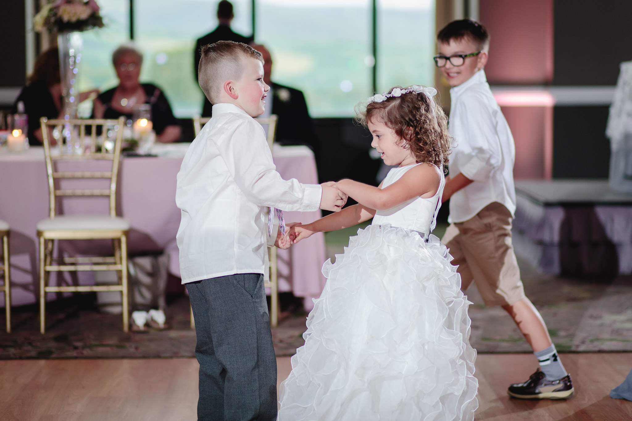 Flower girl and ring bearer dancing at Chestnut Ridge Golf Resort