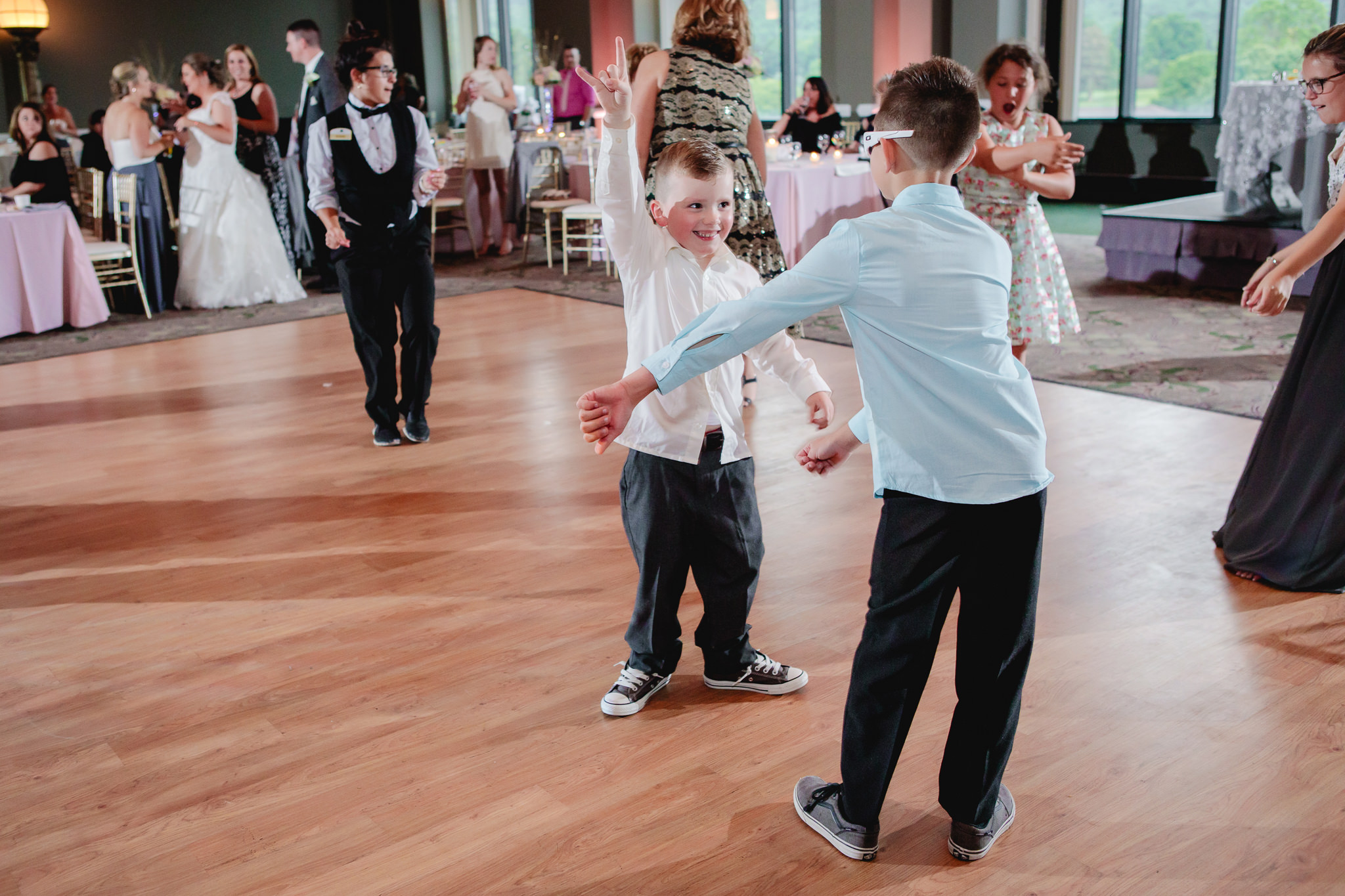 Ring bearer dances with his friend at Chestnut Ridge Golf Resort