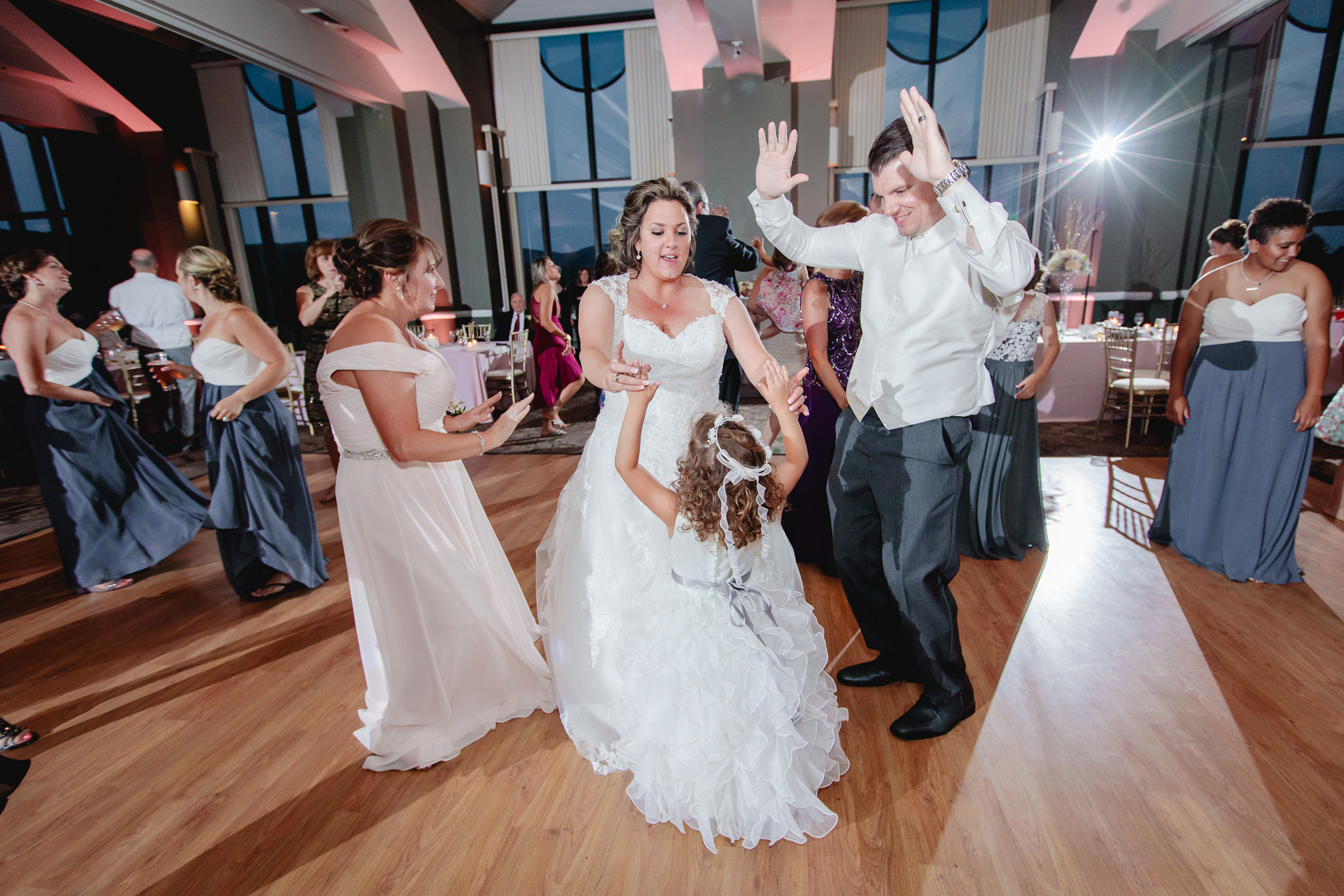 Bride dances with the flower girl at her Chestnut Ridge Golf Resort reception