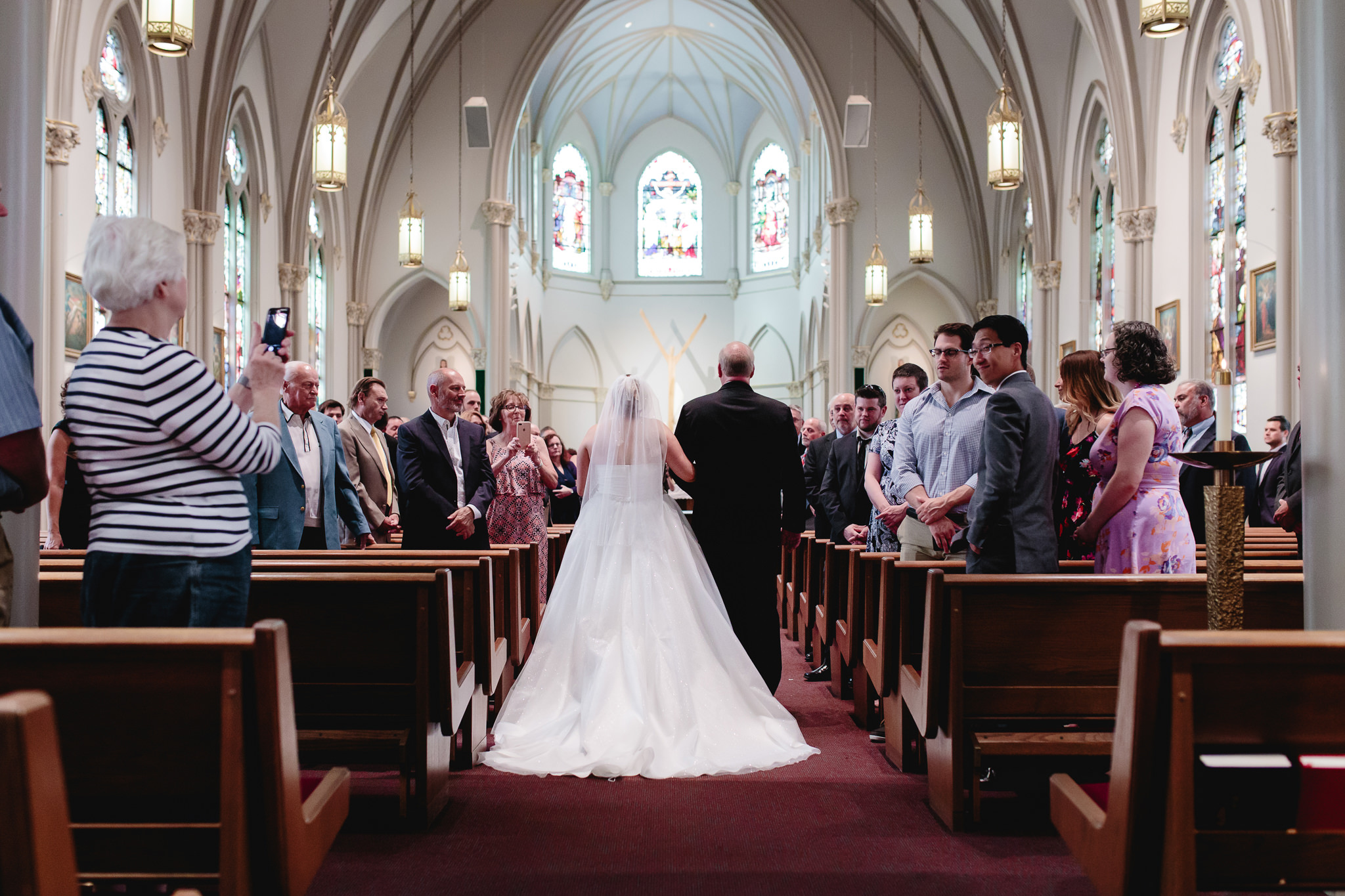 Bride and her father walk down the aisle at Duquesne University Chapel of the Holy Spirit