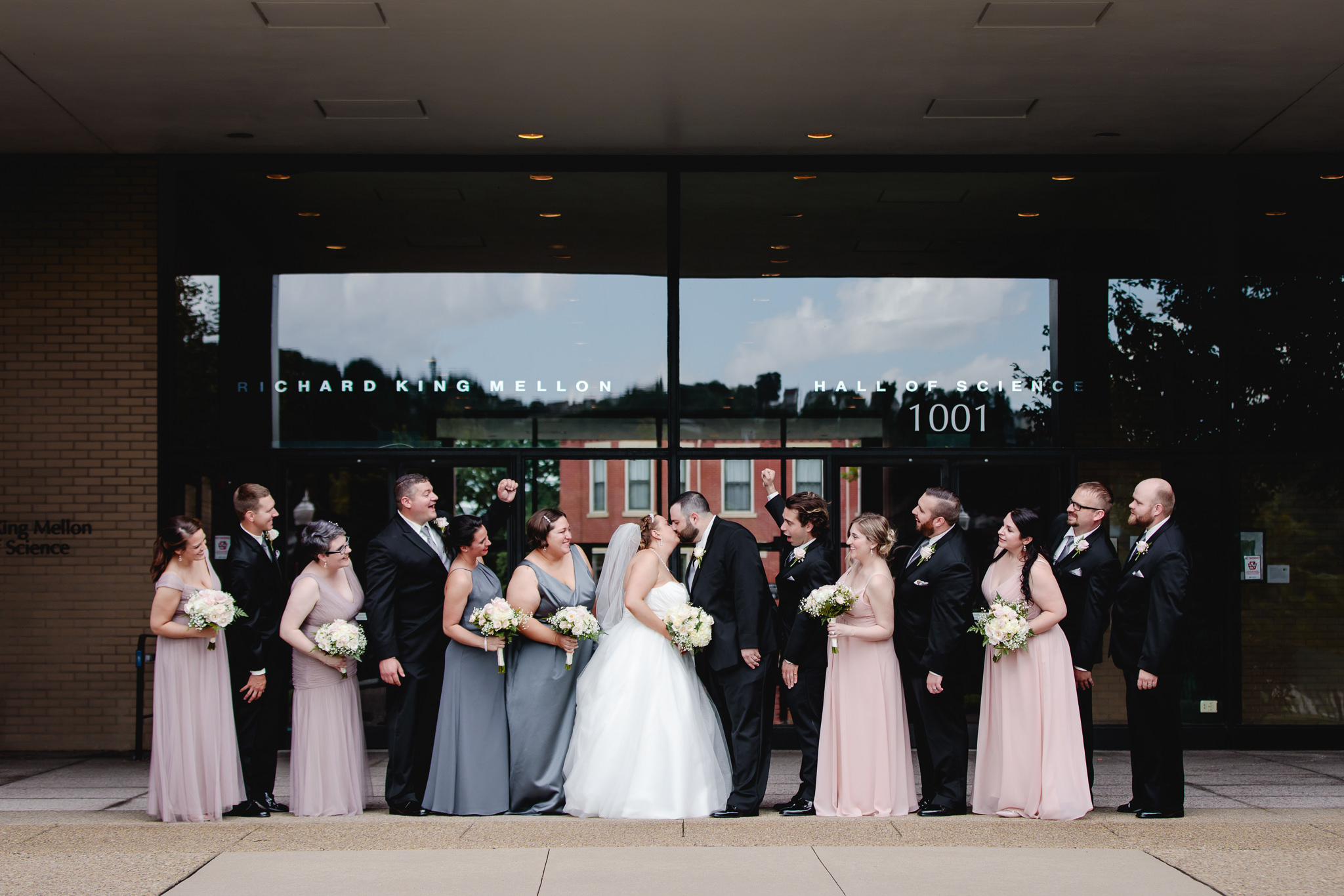 Bridal party cheers as newlyweds kiss at Duquesne University