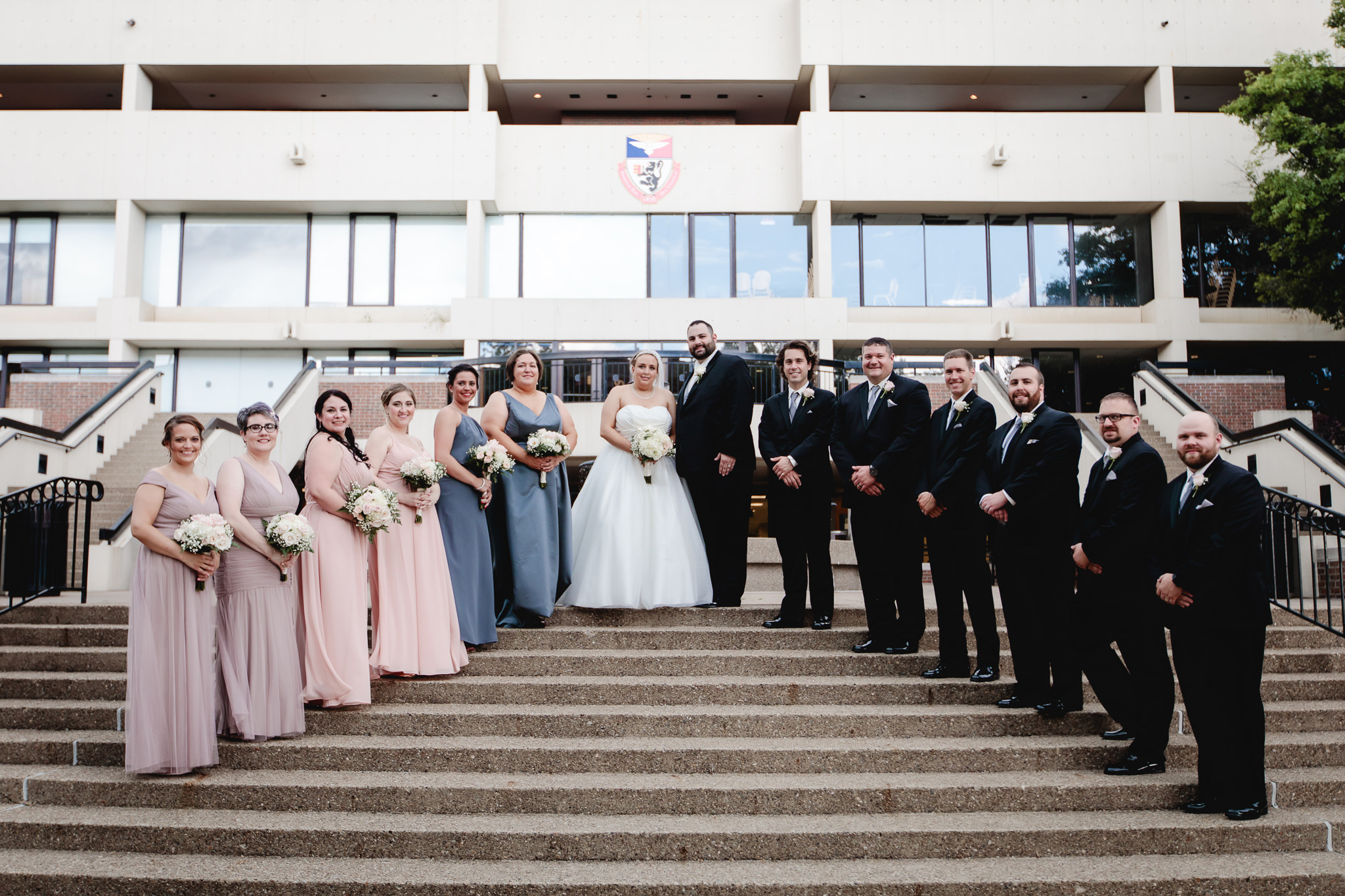 Bridal party poses on the steps of Duquesne University's student union
