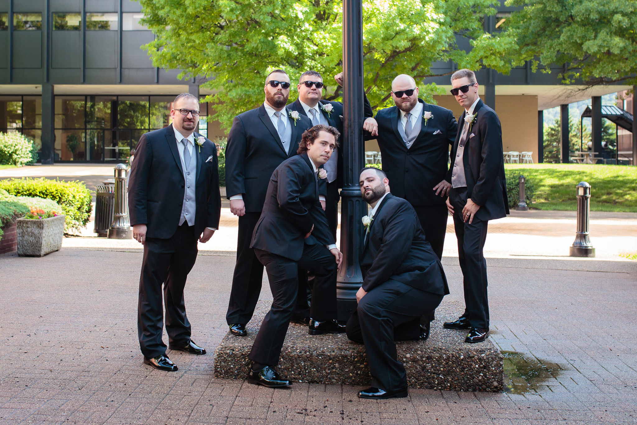 Groomsmen pose like a rock band at Duquesne University