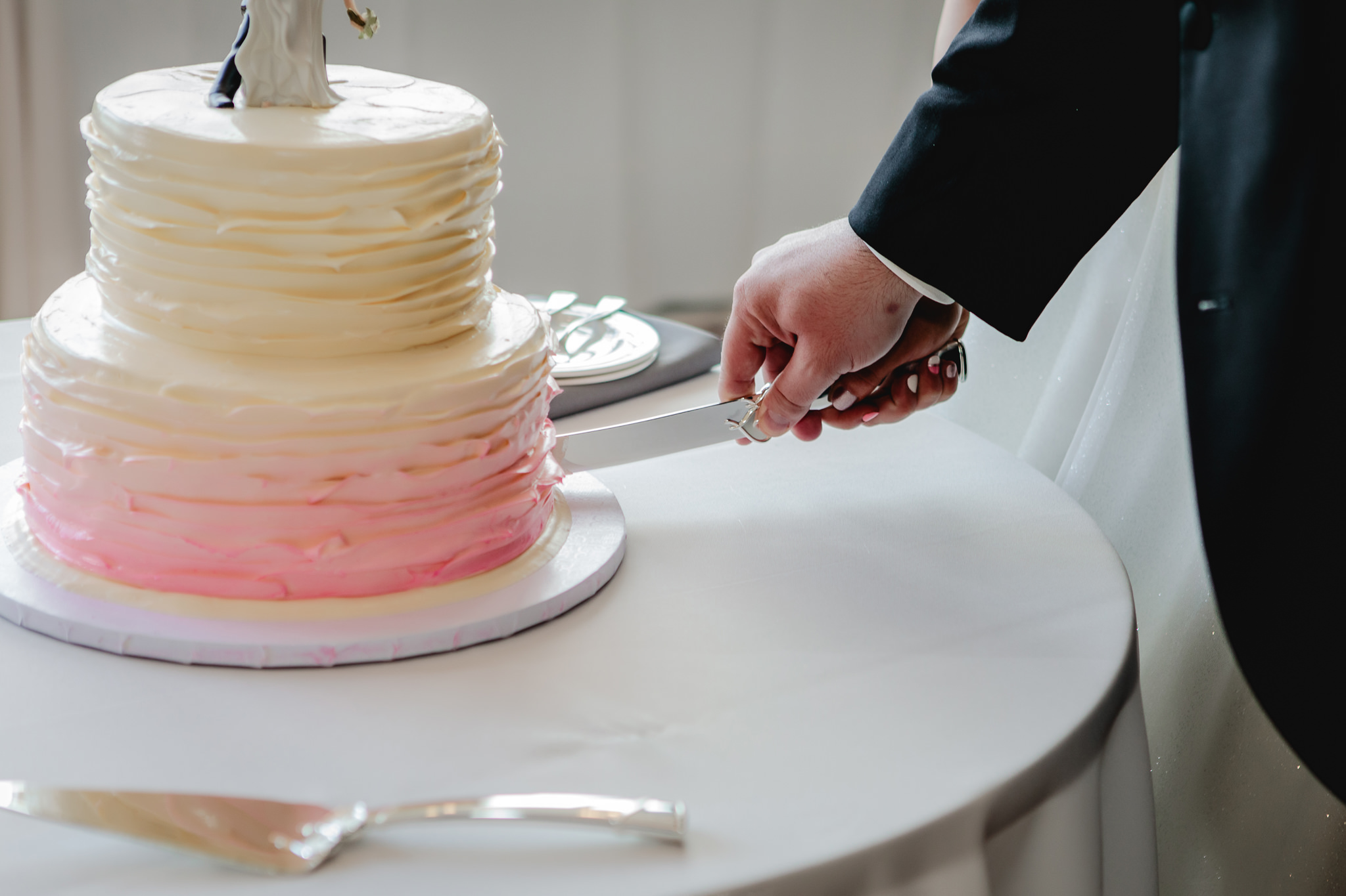 Caking cutting during a Duquesne University wedding reception