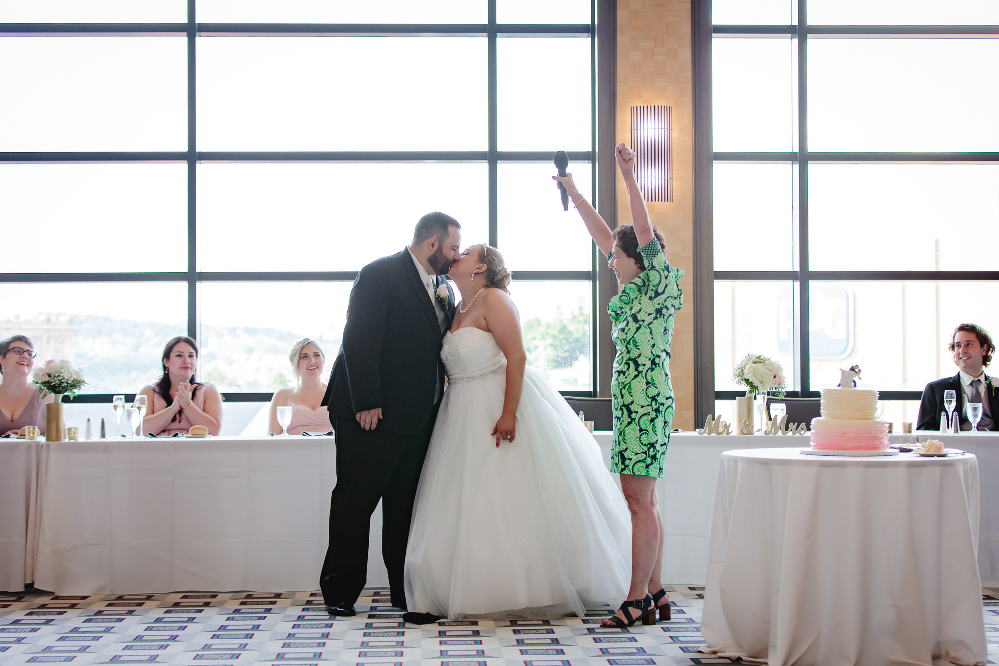 Newlyweds kiss after breaking the glass at Duquesne University