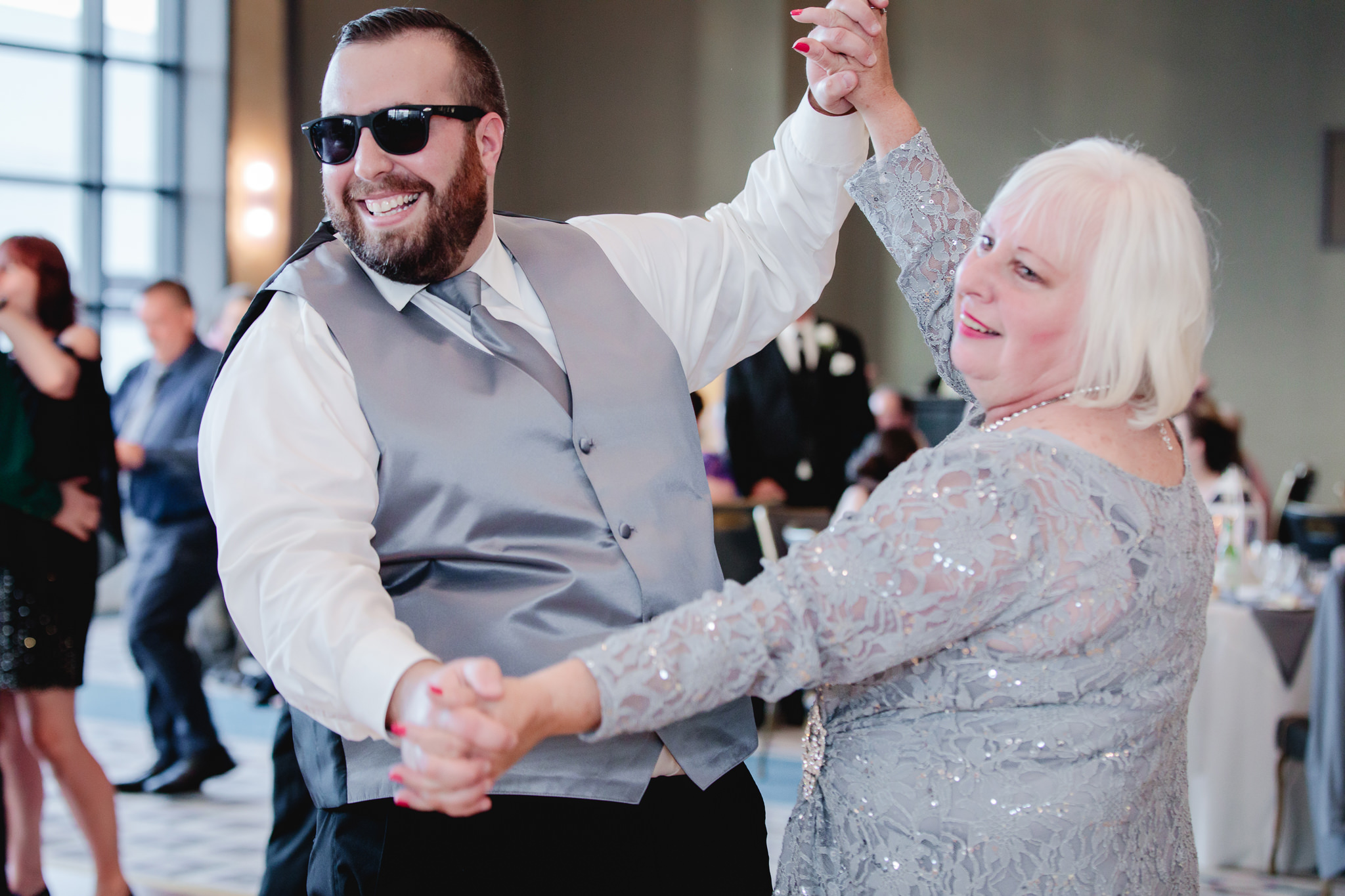 Groomsman dances with his mother at Duquesne University