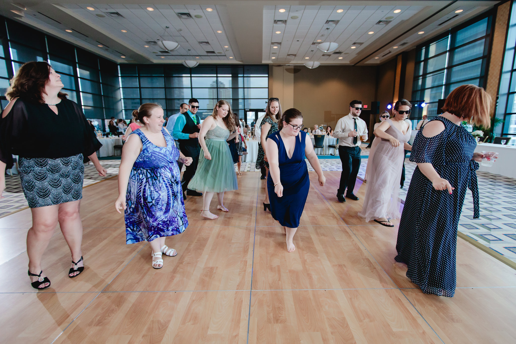 Guests line dancing at a Duquesne University wedding reception