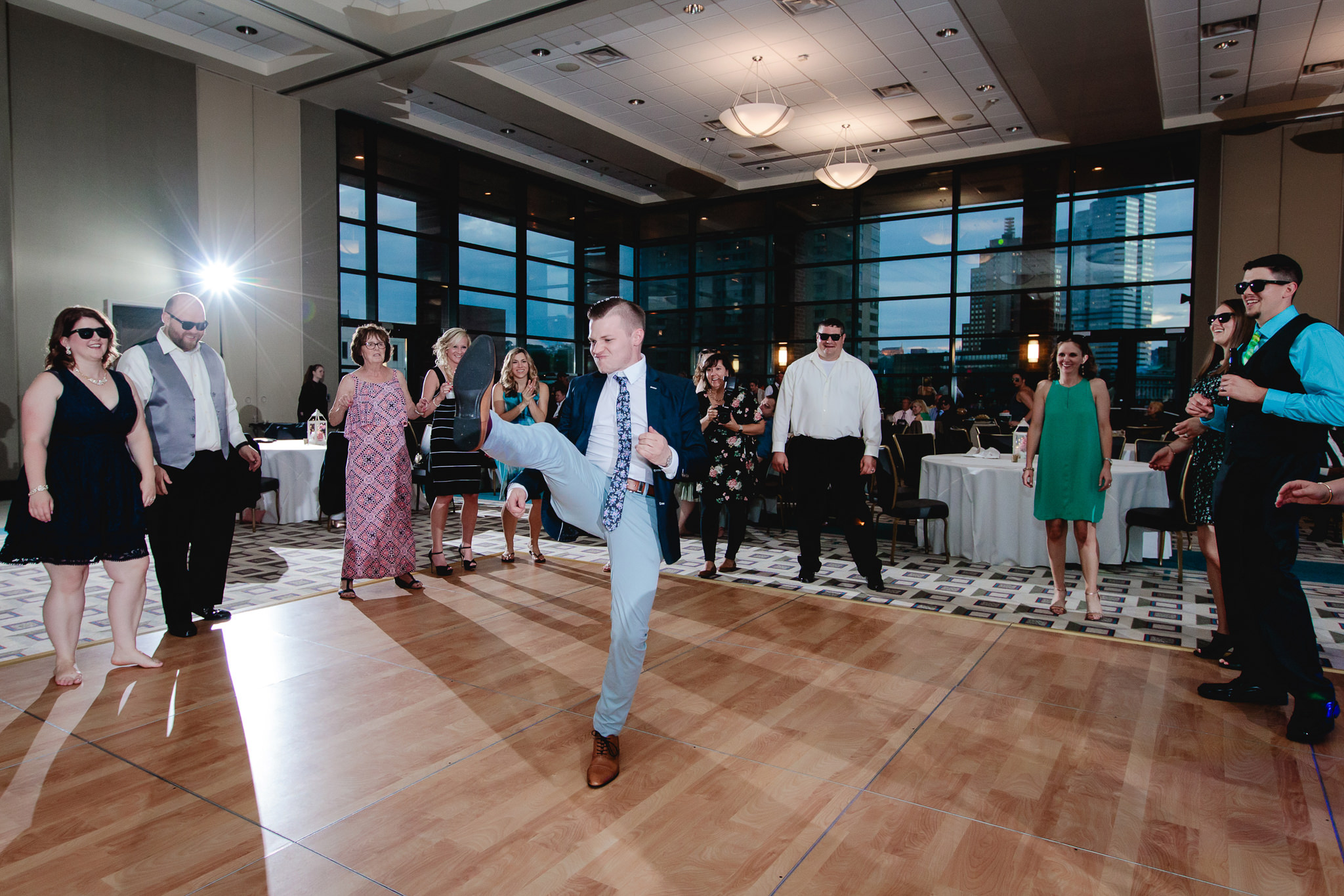 Guest dances inside a circle at Duquesne University