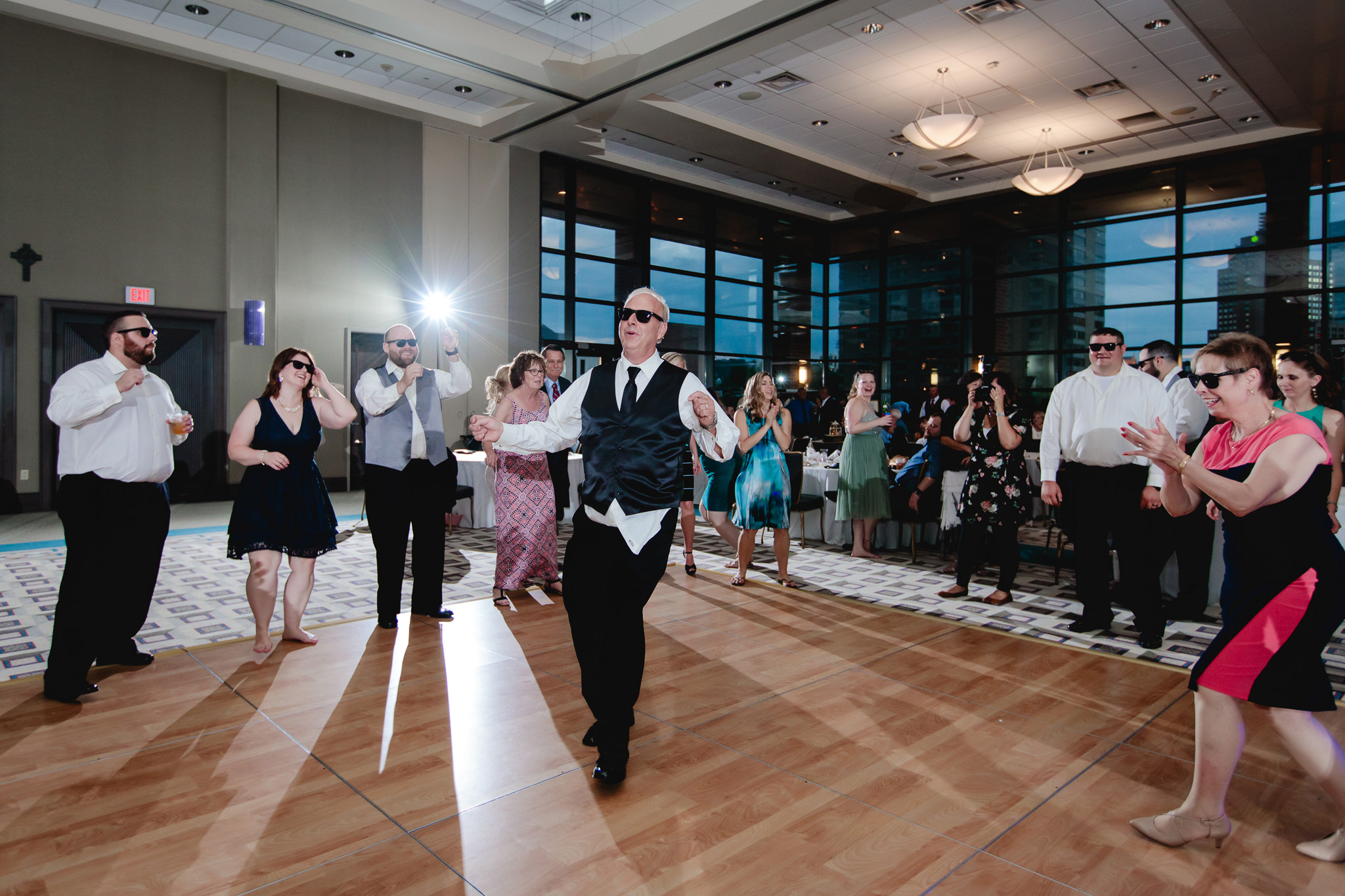 Father of the bride dances in the middle of the dance floor at Duquesne University