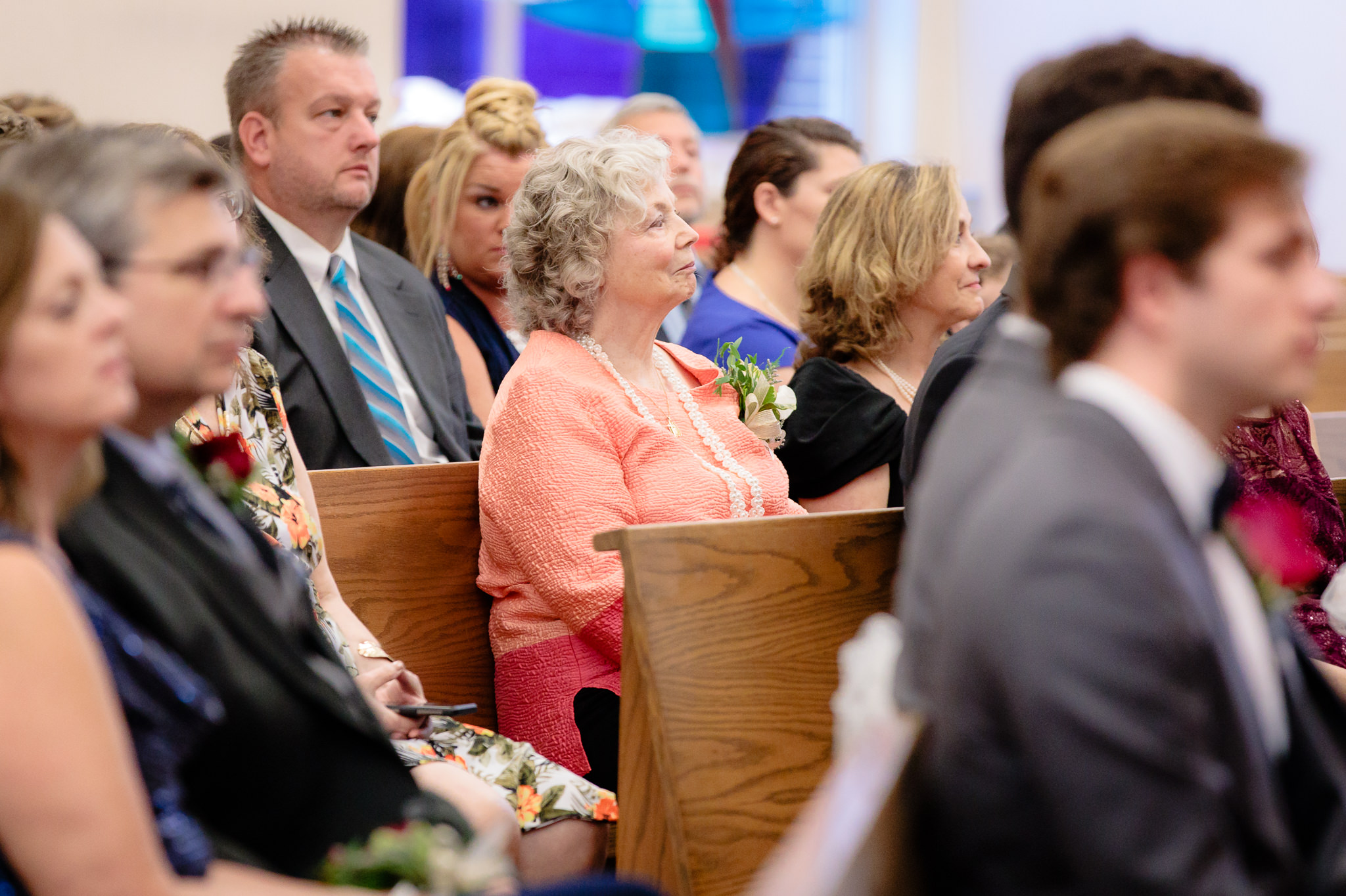 Grandmother of the bride smiles during a wedding ceremony at Saint Monica Parish in Beaver, PA