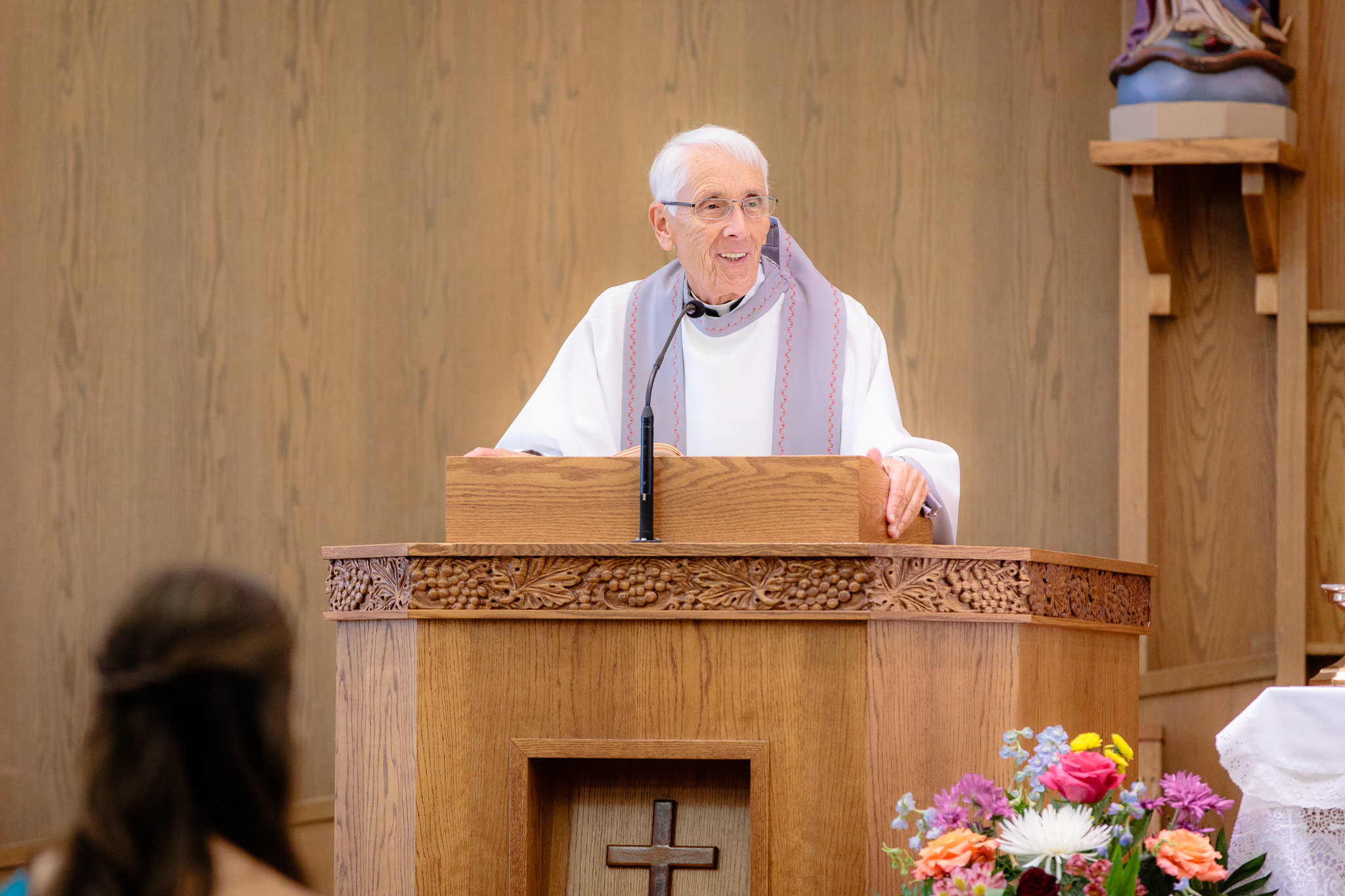 Fr. William Schwartz speaks at a wedding ceremony at Saint Monica Parish