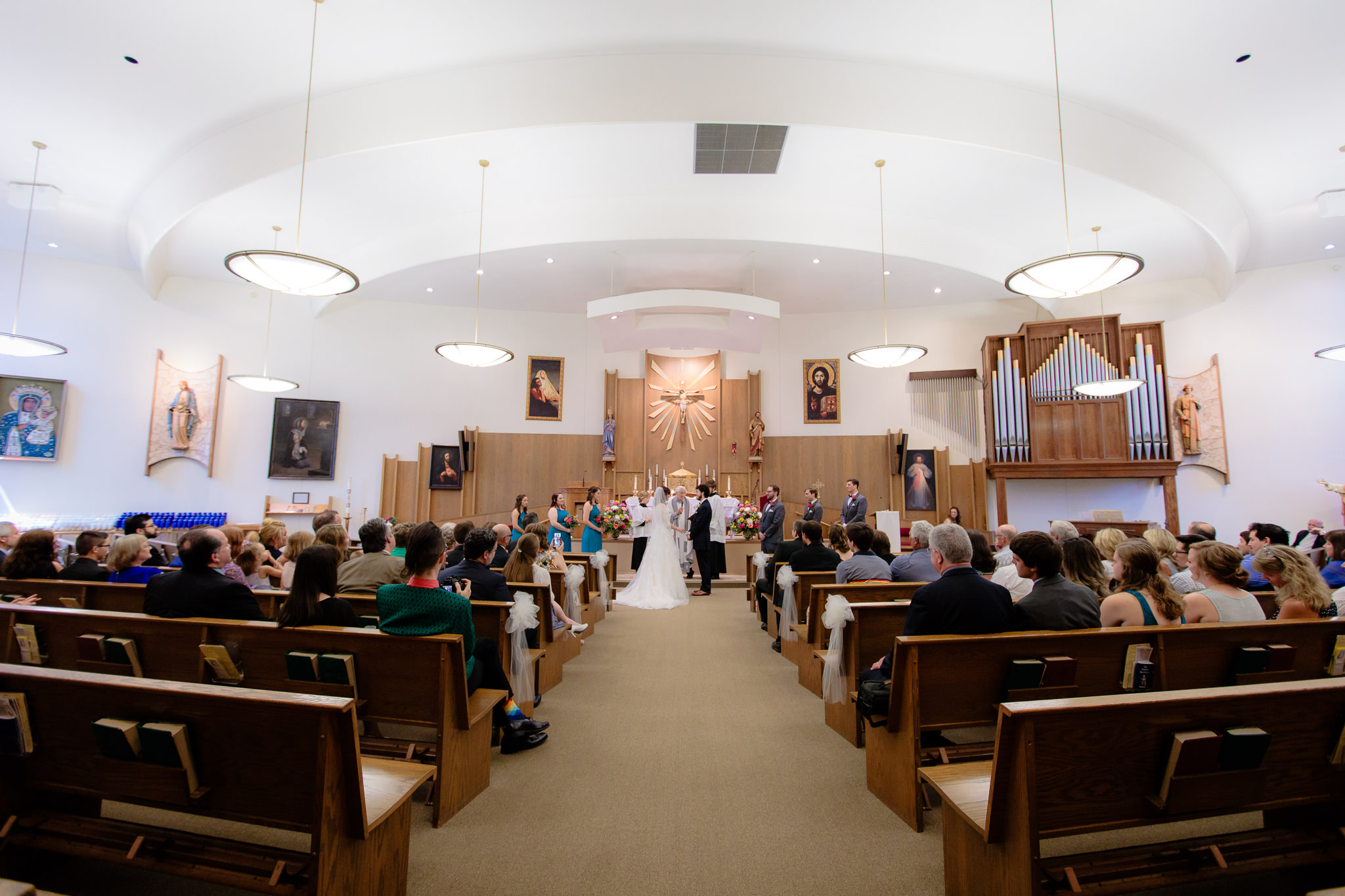 Wedding party stands at the altar of Saint Monica Parish in Beaver, PA