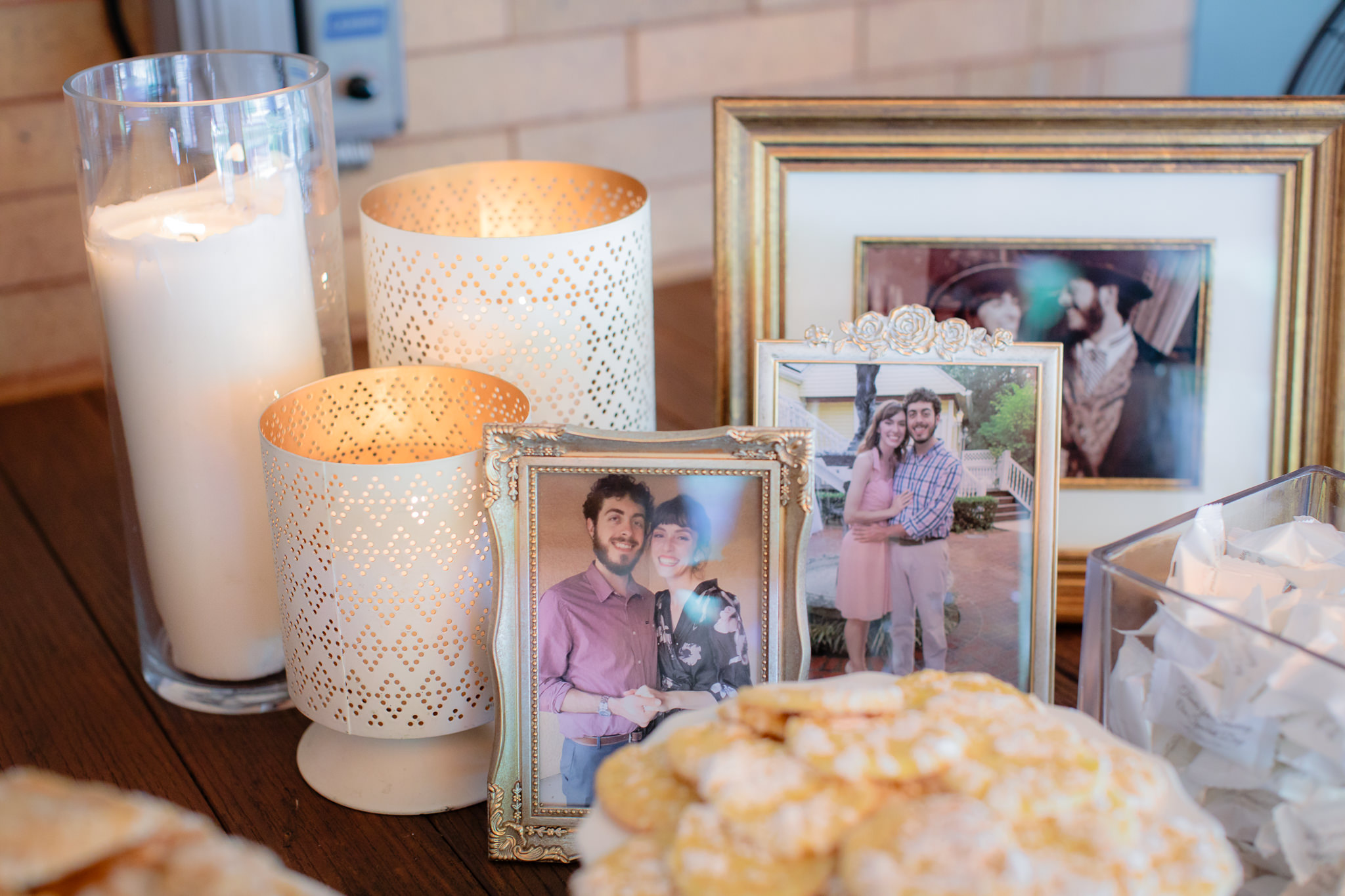 Photos of the couple on the cookie table at a Beaver Station wedding