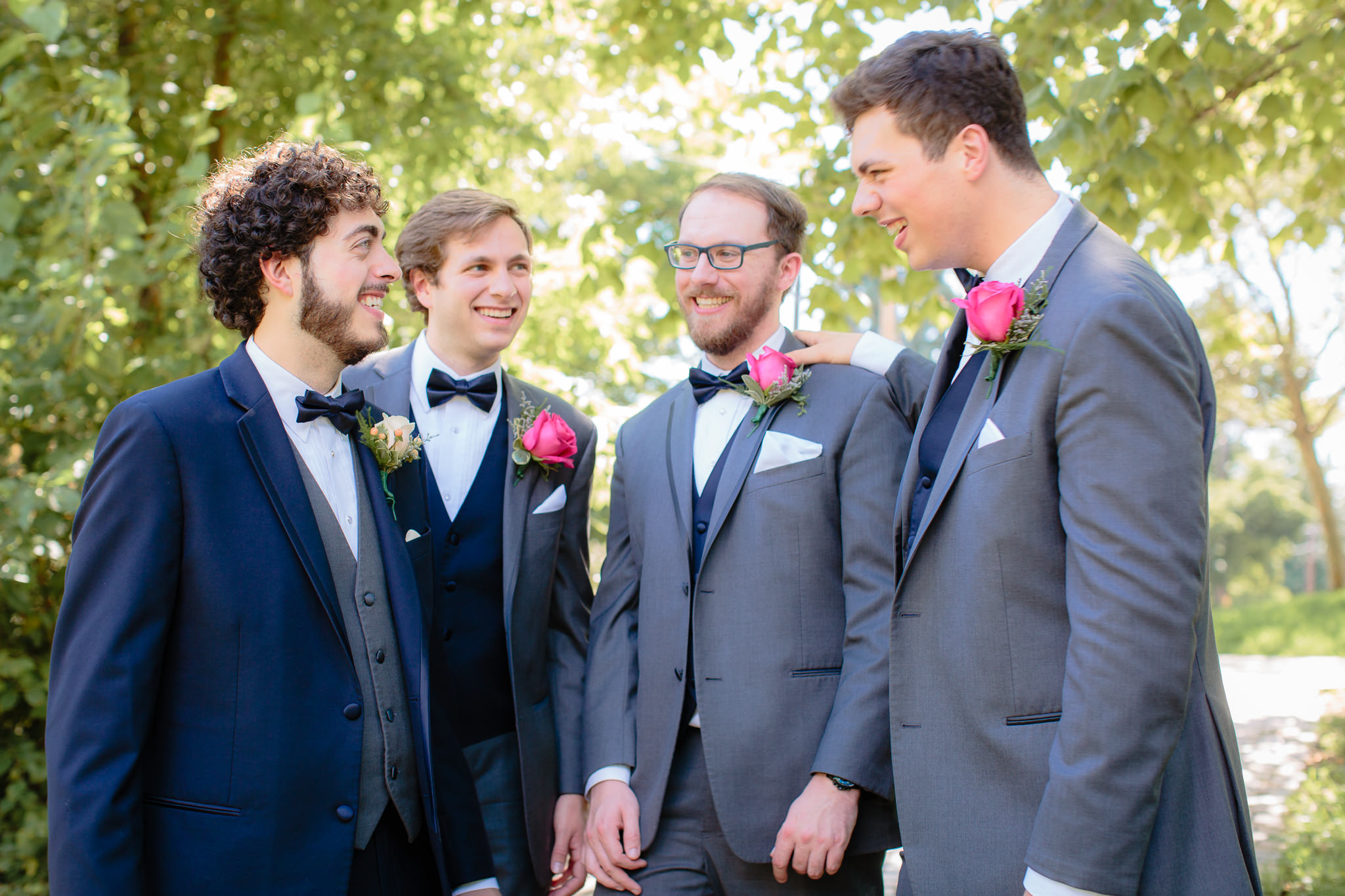 Groomsmen share a laugh at a Beaver Station wedding