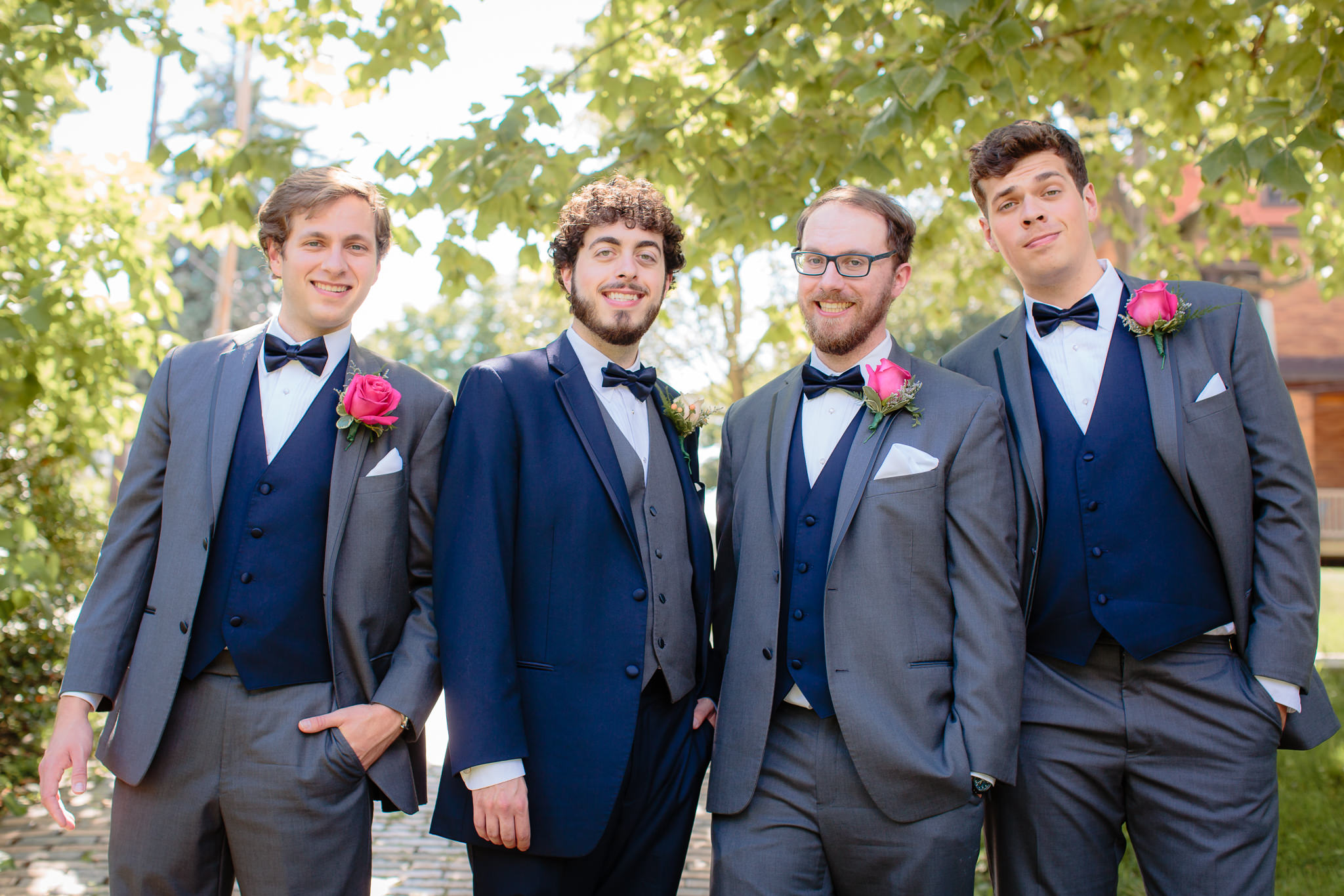Groomsmen wear grey & navy tuxes at a Beaver Station wedding