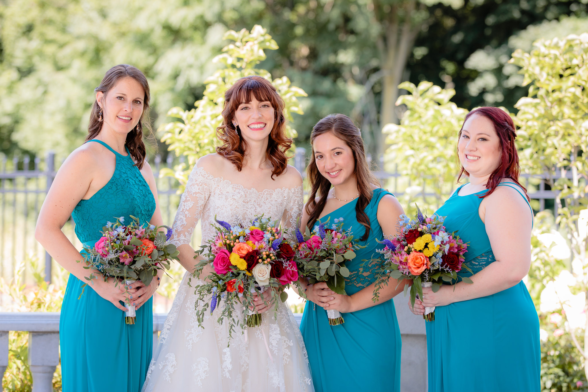 Bridesmaids wear turquoise gowns from David's Bridal at Beaver Station