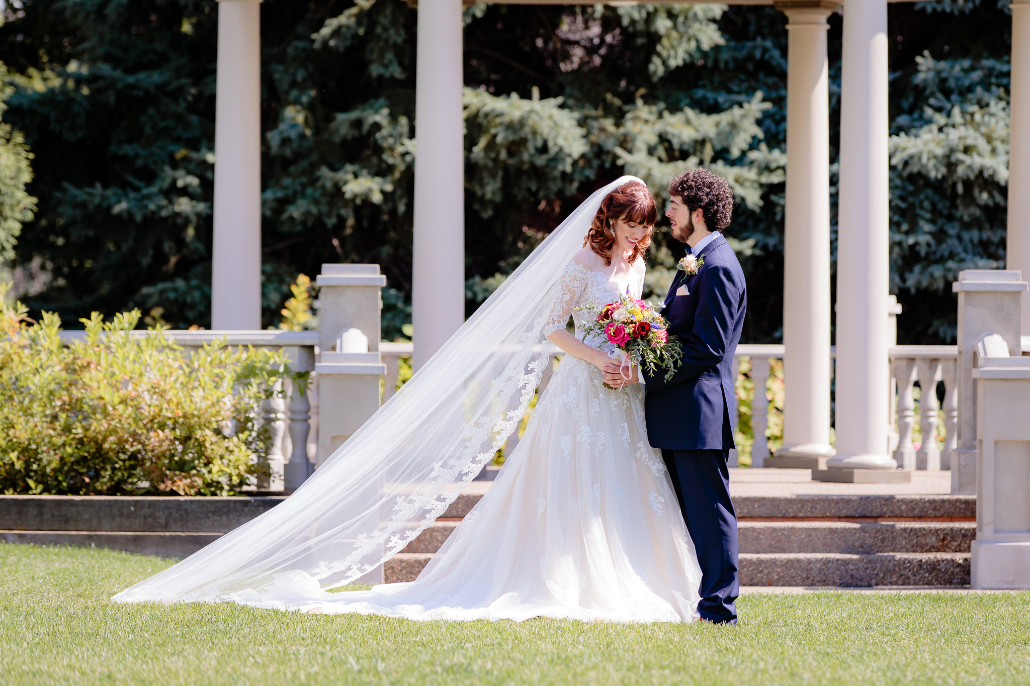 Bride's cathedral veil floats behind her at Beaver Station