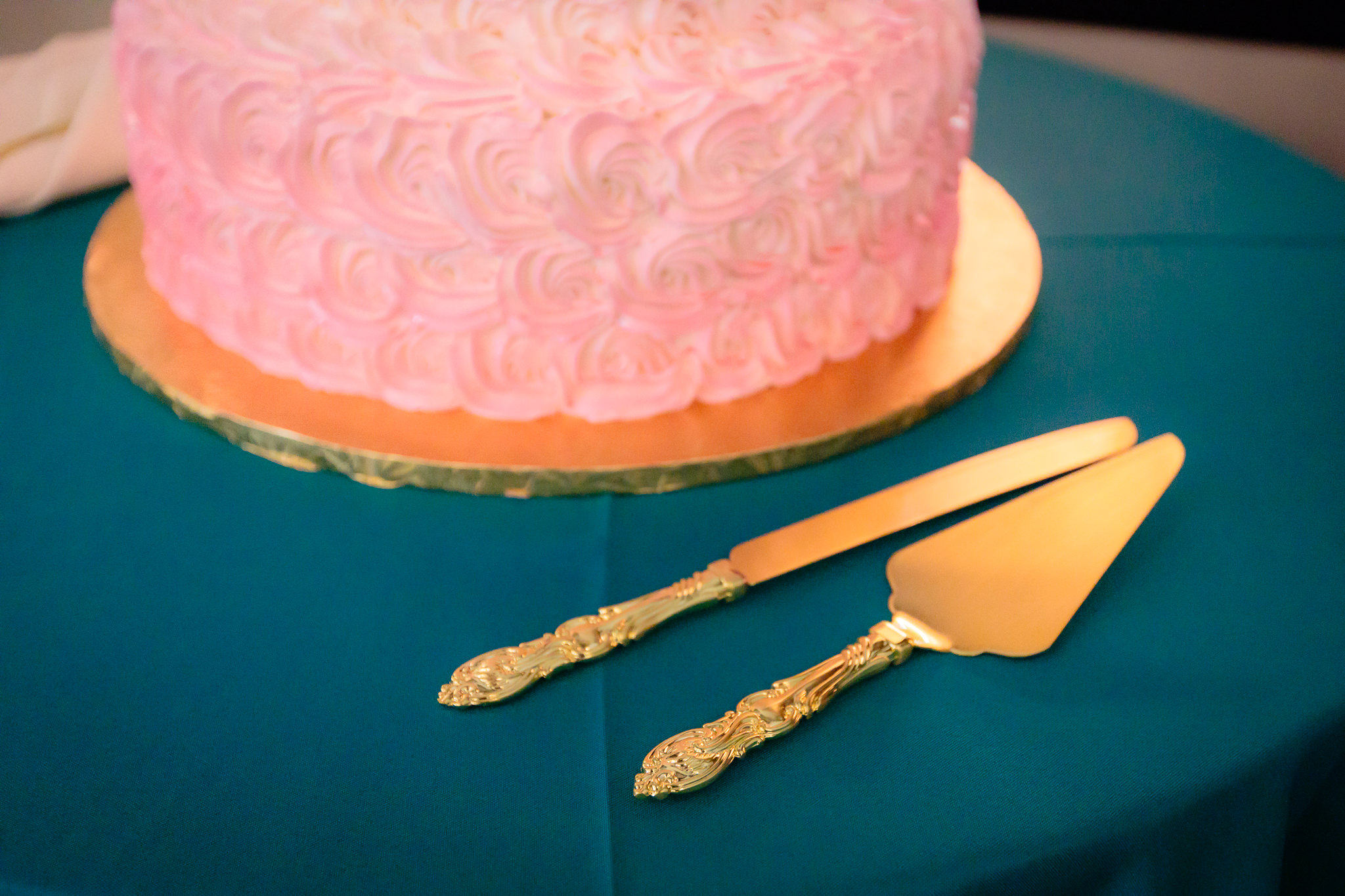 Gold cake knife and servers at a Beaver Station wedding reception