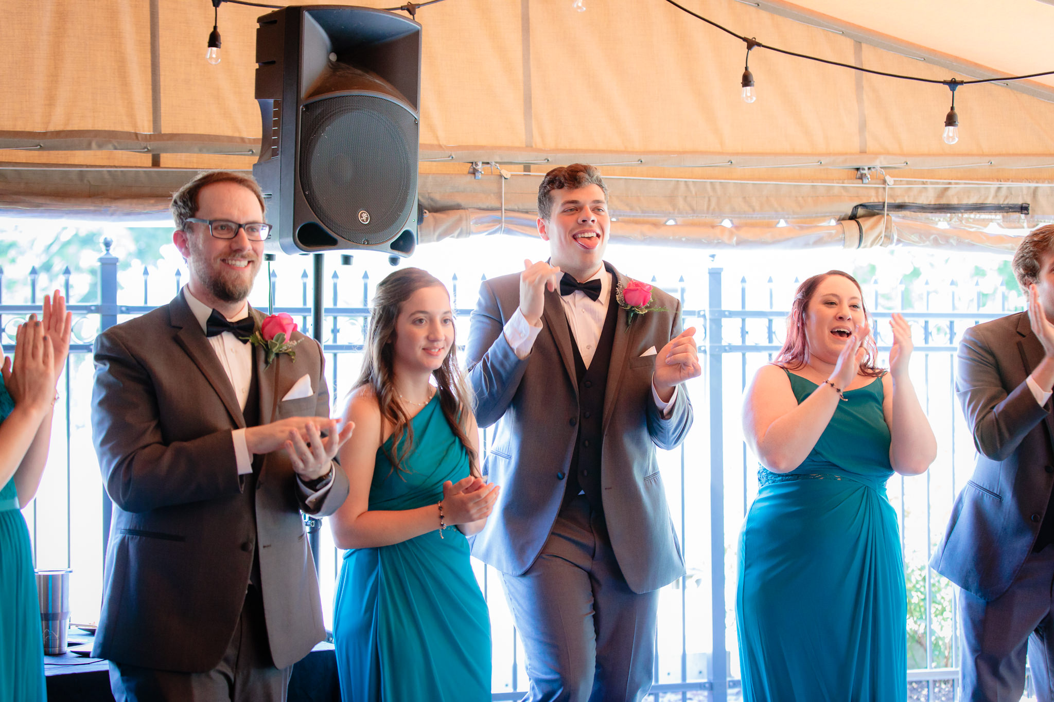 Bridal party cheers as newlyweds enter their Beaver Station wedding reception