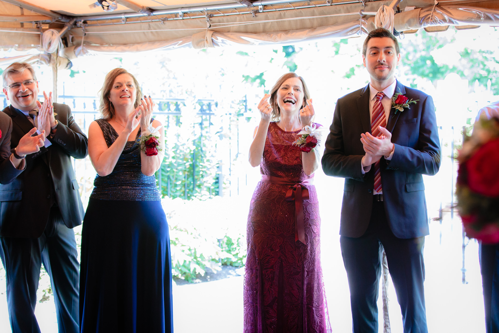 Parents of the newlyweds cheer as they enter their wedding reception at Beaver Station