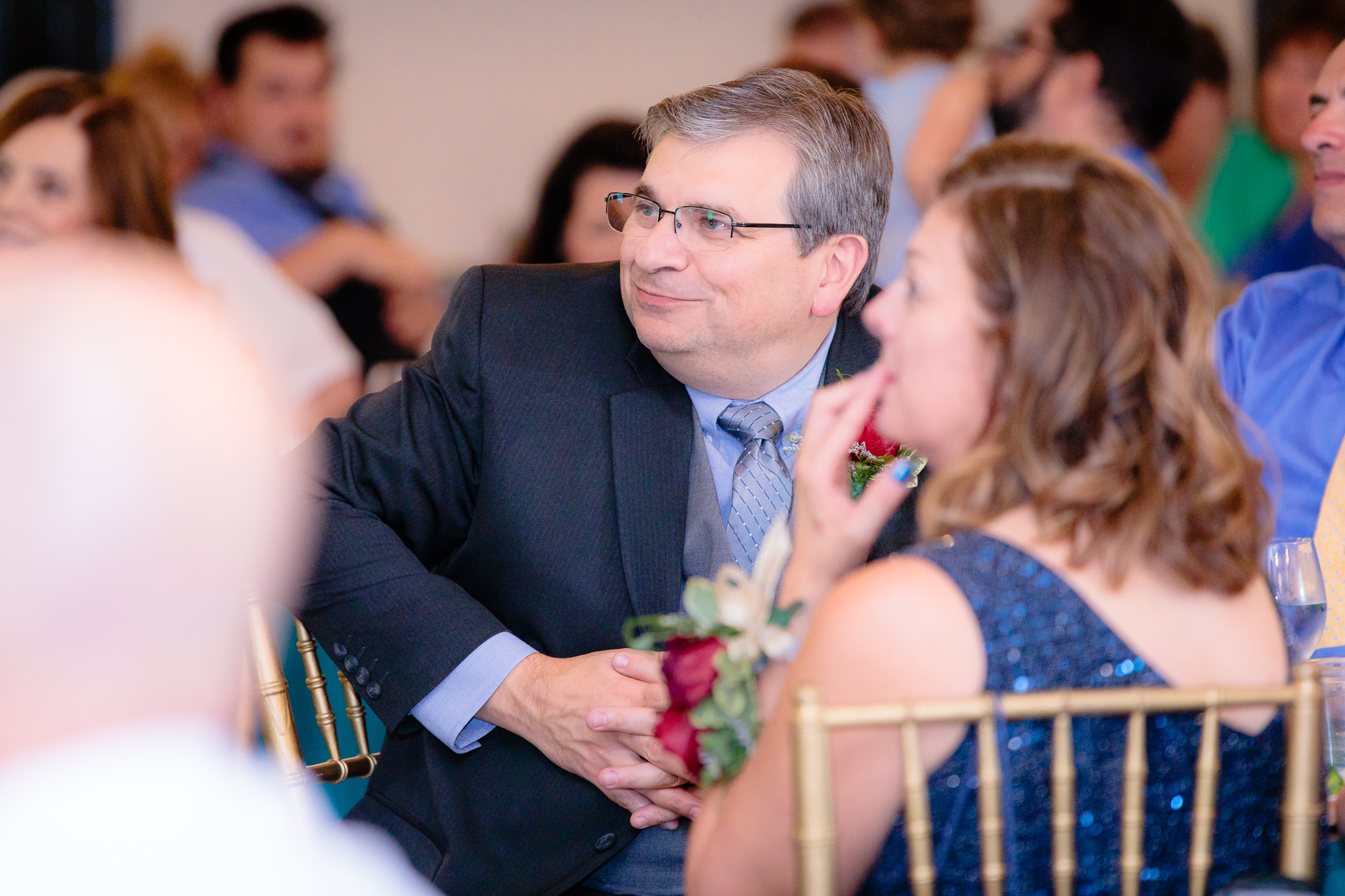 Father of the groom listens to speeches at Beaver Station