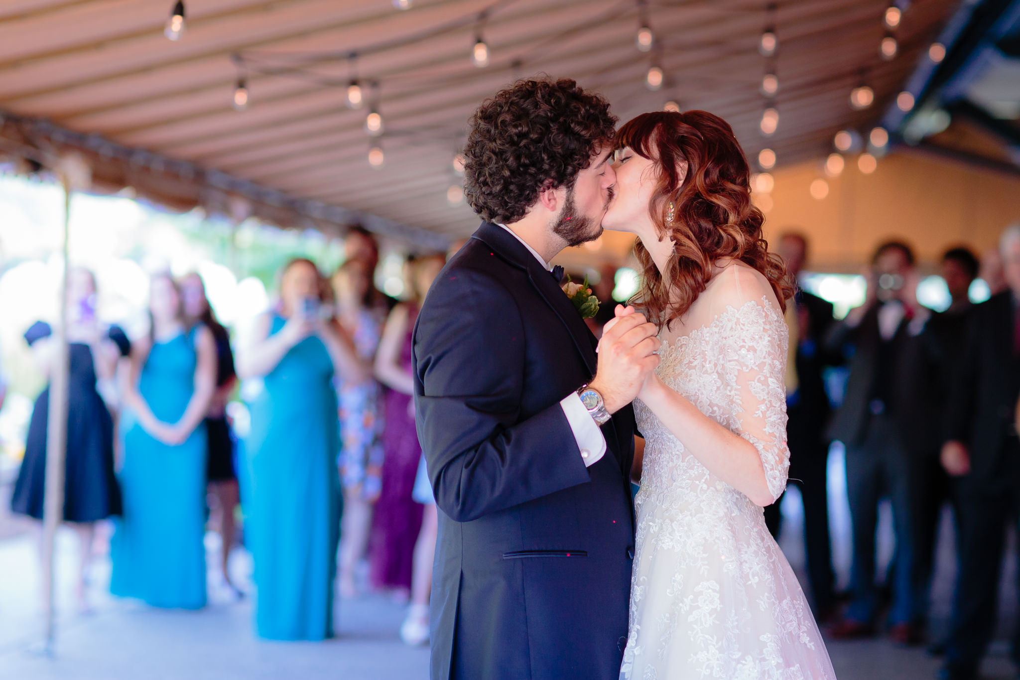 Newlyweds kiss during their first dance at Beaver Station