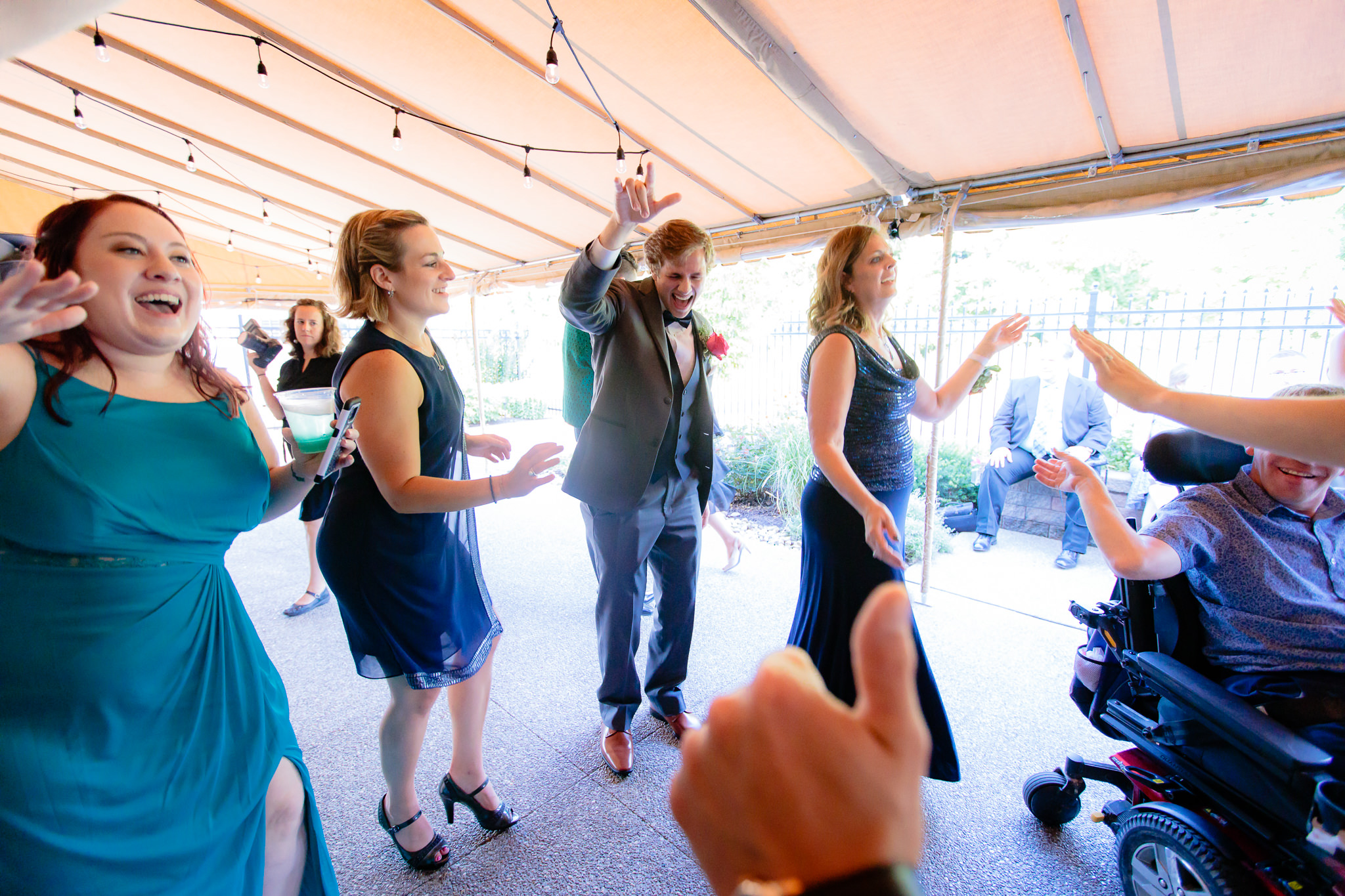 Guests dance on the outdoor dance floor at a Beaver Station wedding