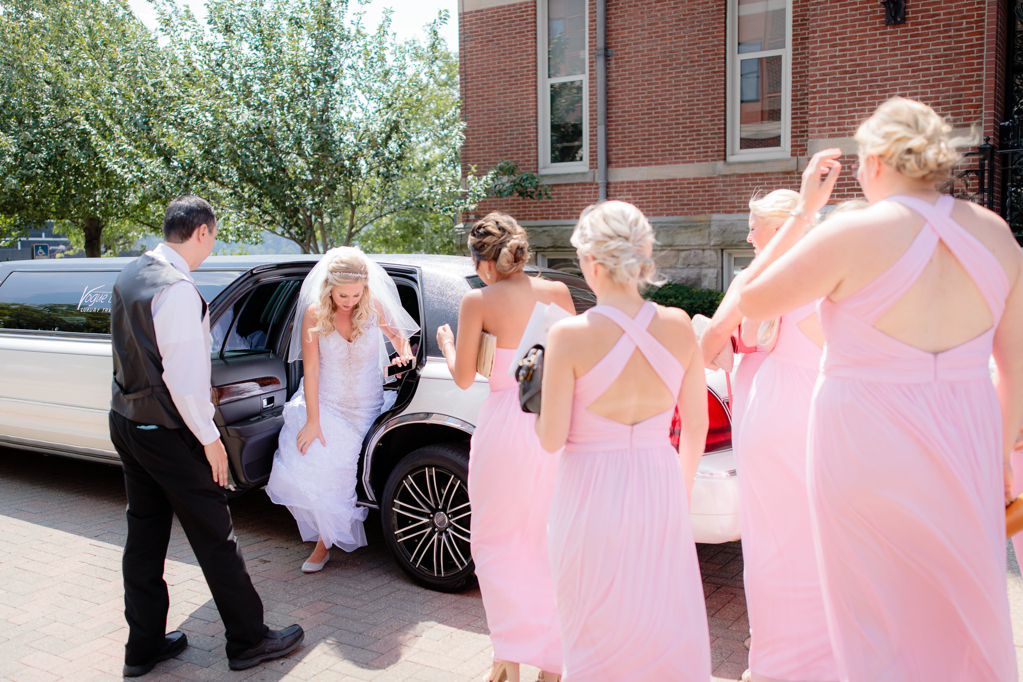Bride arrives in a limo to her Duquesne University Chapel of the Holy Spirit wedding ceremony
