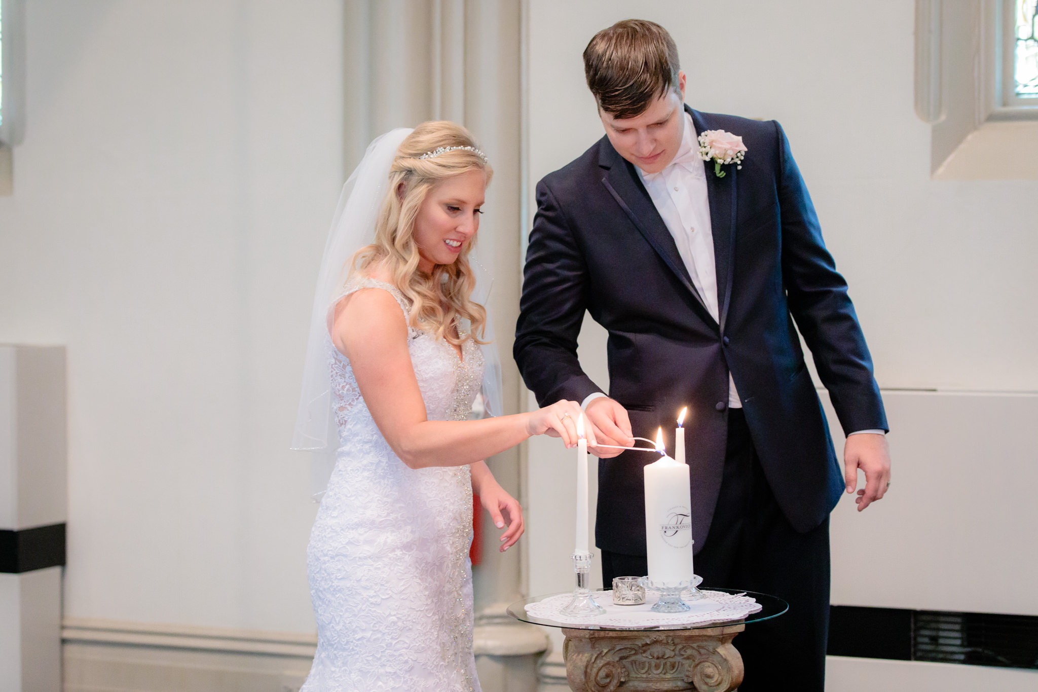 Bride & groom light their unity candle at Duquesne University's Chapel of the Holy Spirit