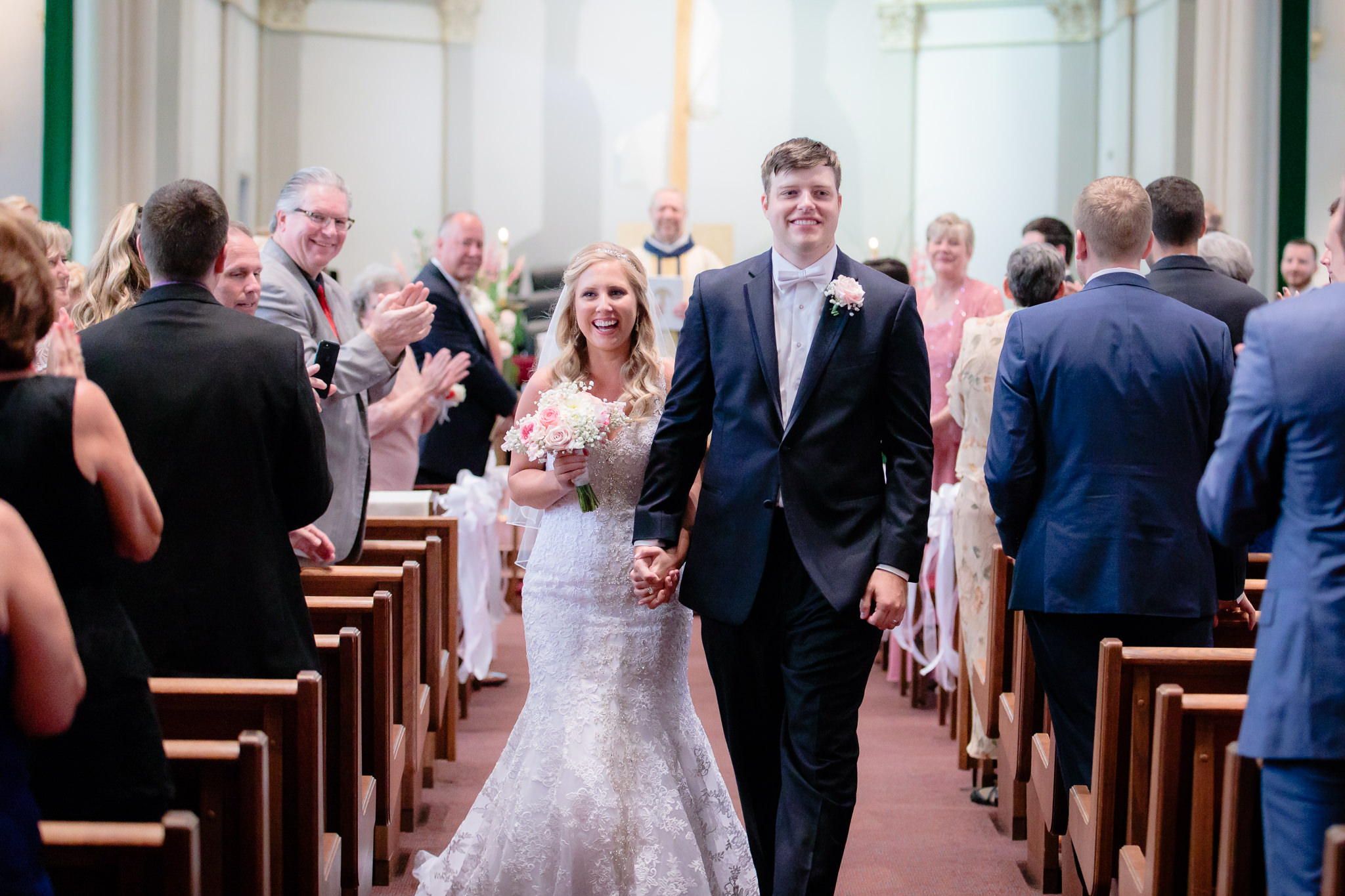 Newlyweds exit their wedding ceremony at Duquesne University
