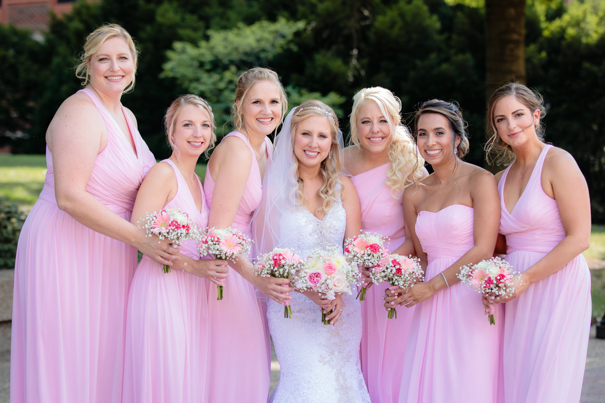 Bridesmaids wear pink dresses from David's Bridal at Duquesne University