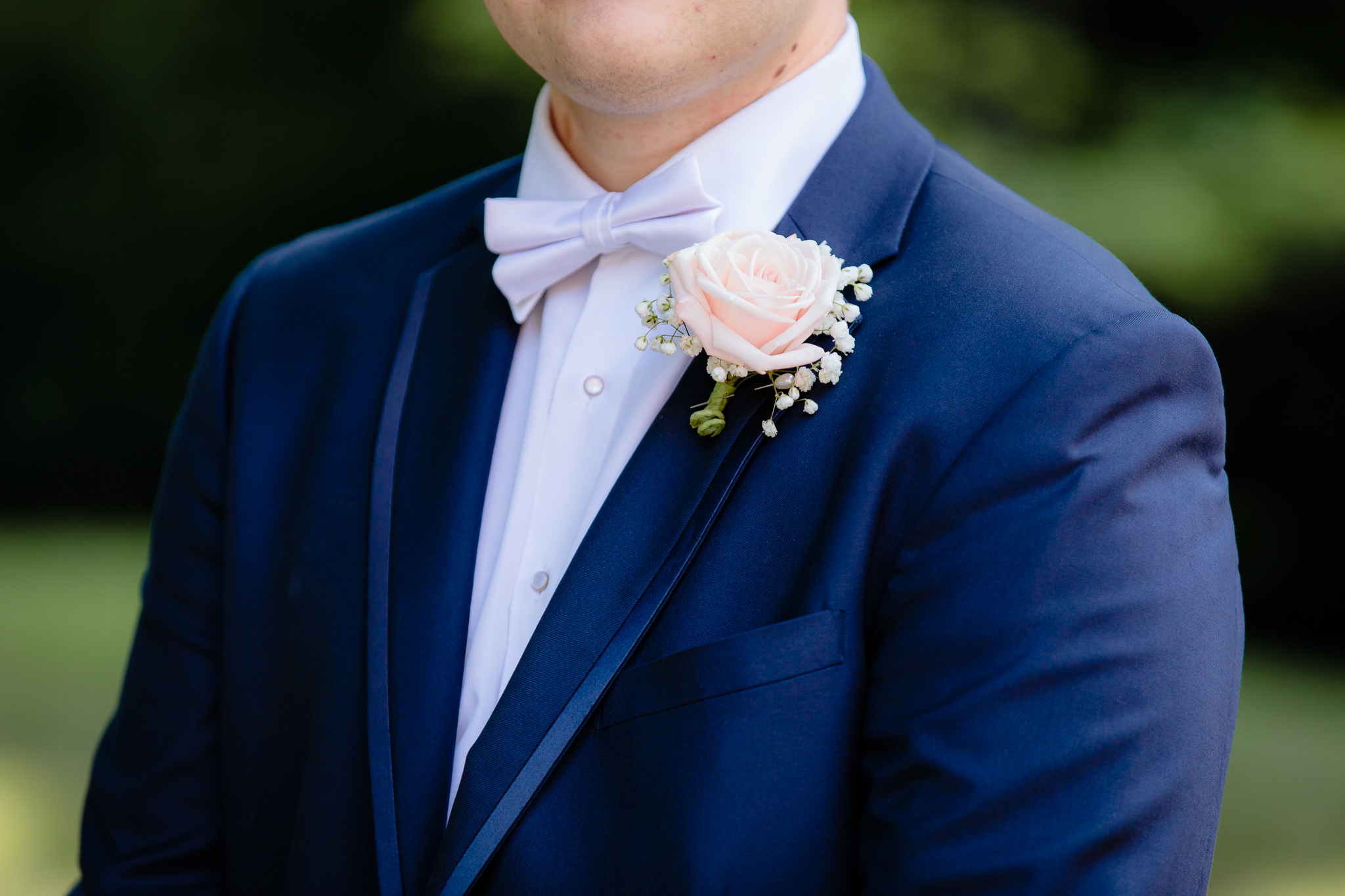 Groom's rose boutonniere by Fields of Heather at Duquesne University