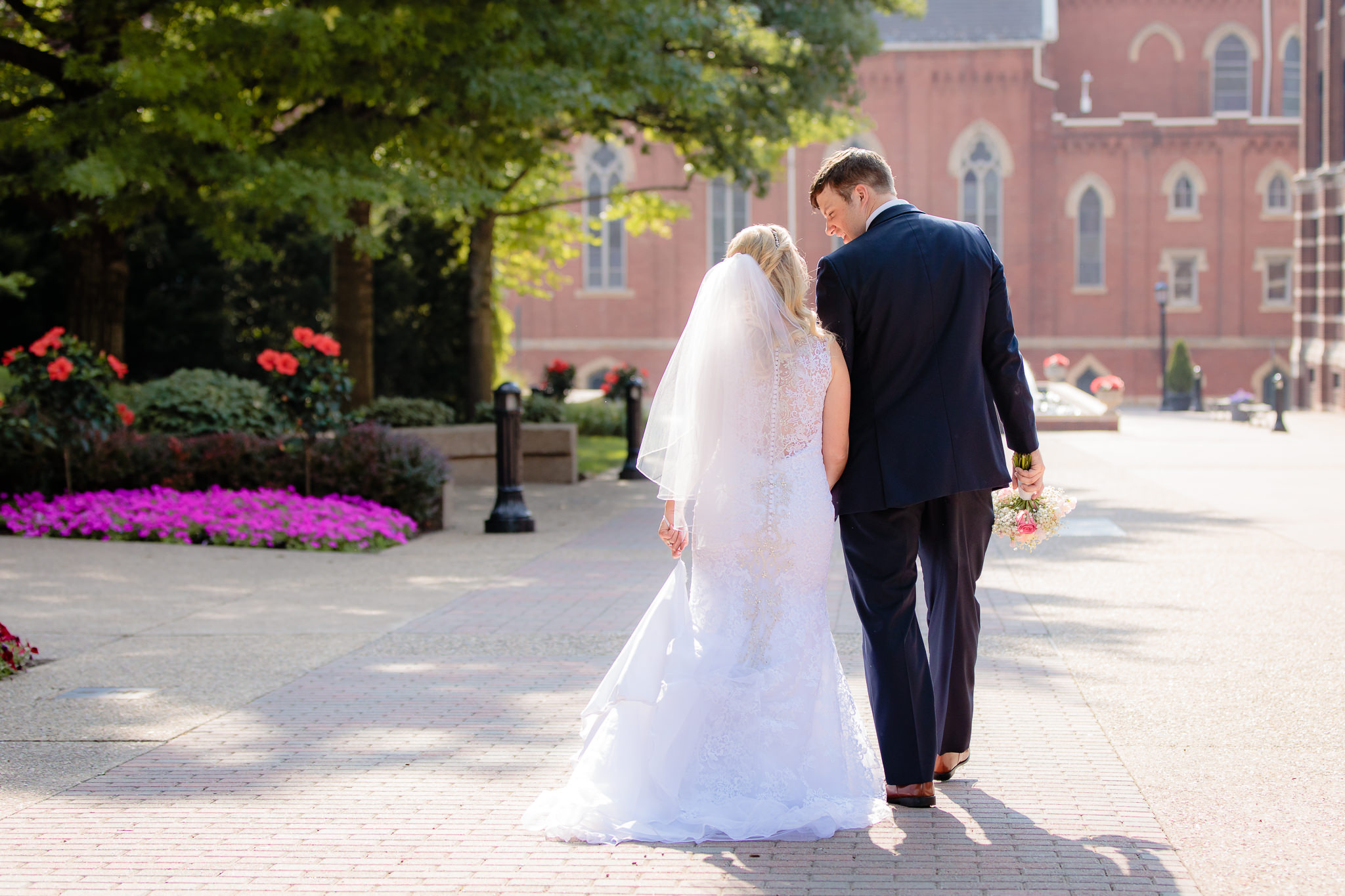 Newlyweds walk down A-Walk at Duquesne University
