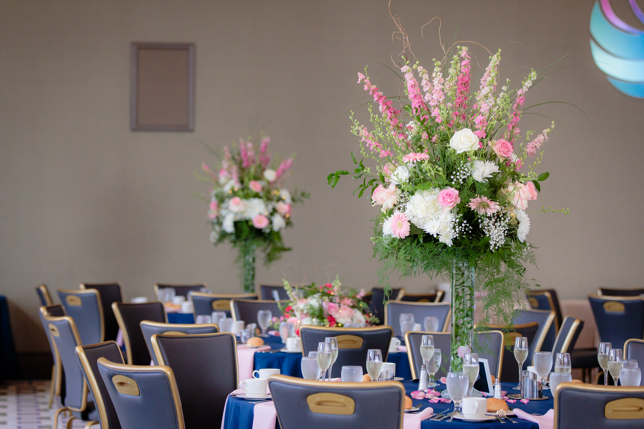 Tall floral centerpieces by Fields of Heather at a wedding reception at Duquesne University