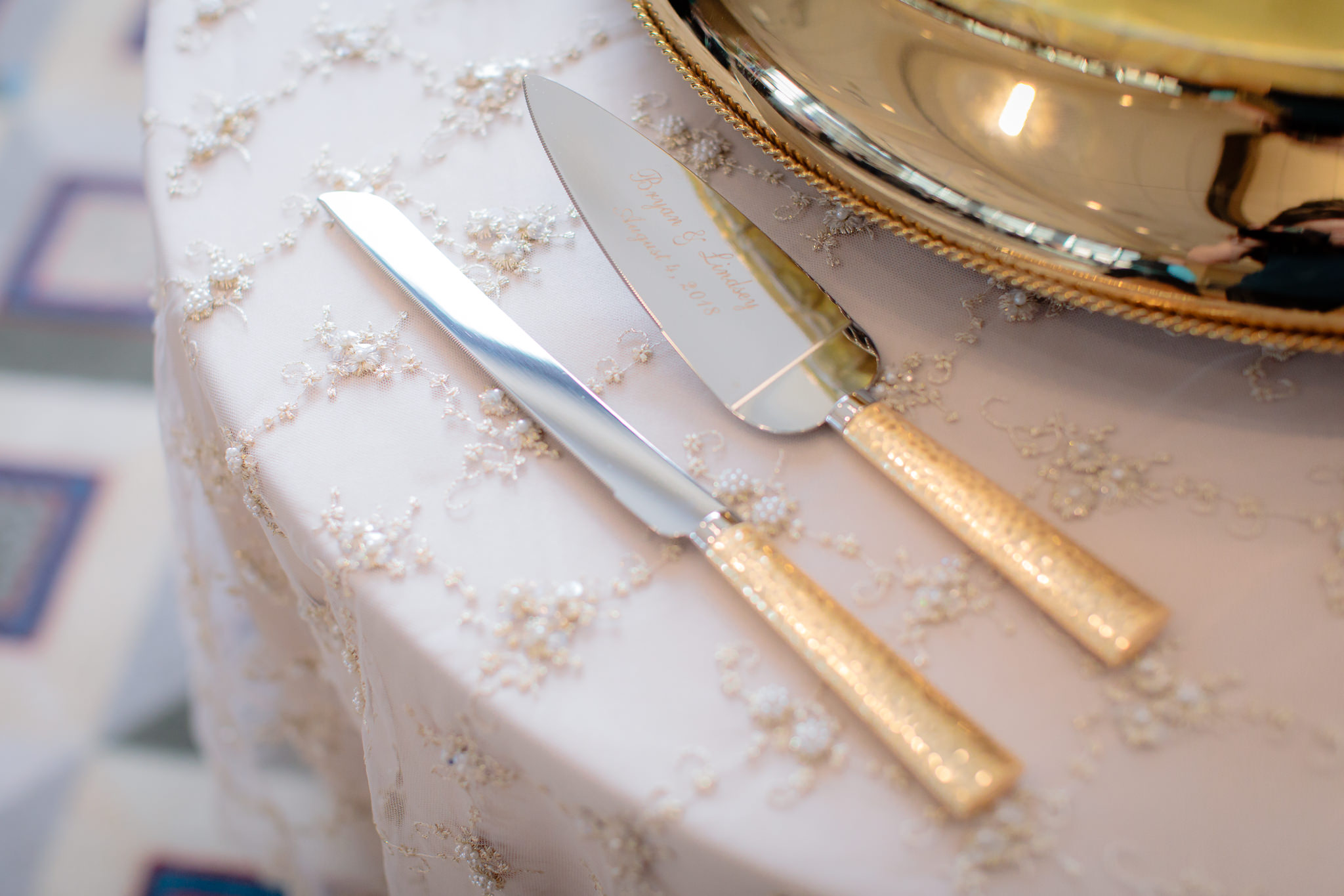 Gold plated cake knife and server at a Duquesne University wedding