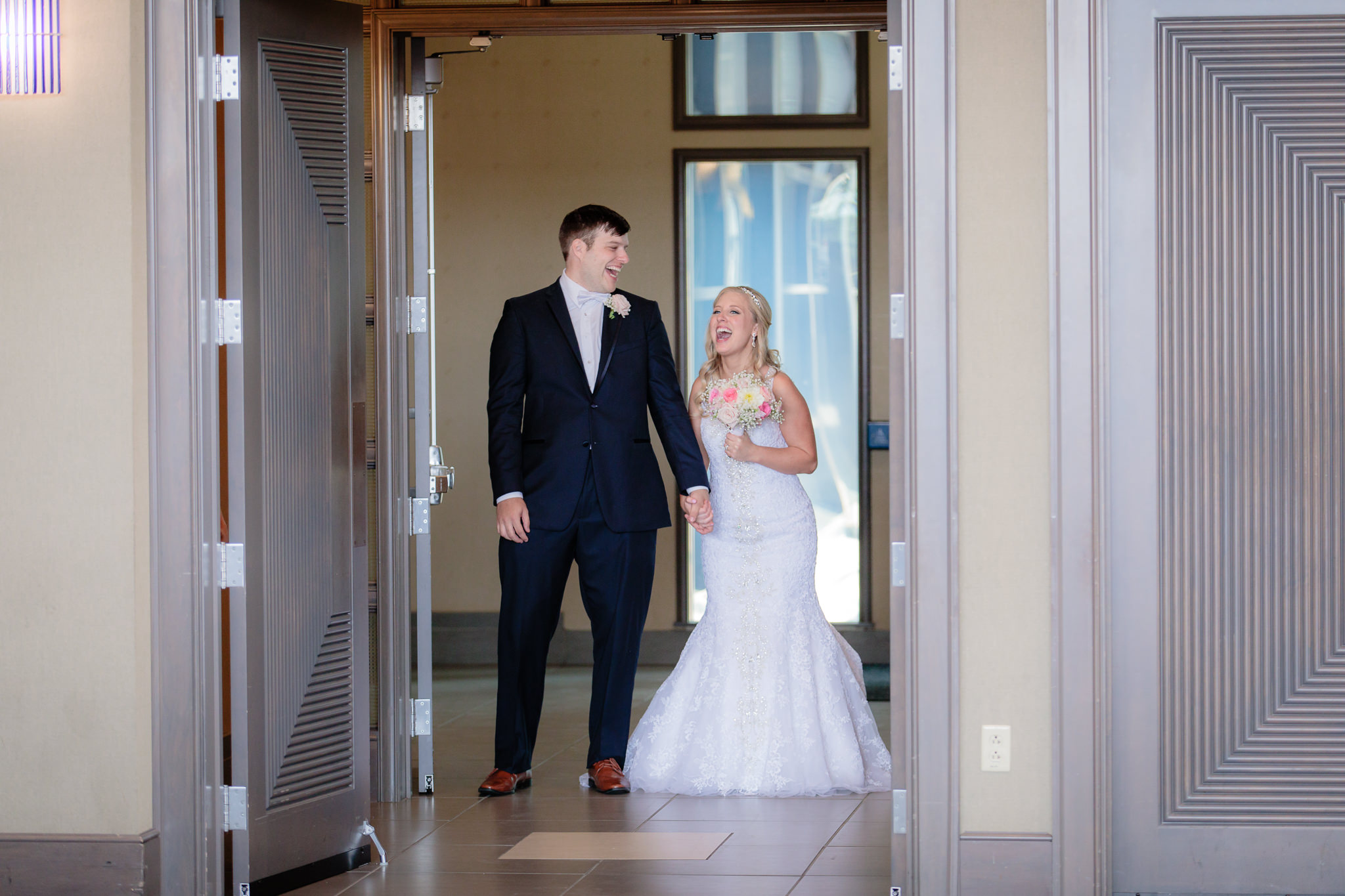 Bride & groom laugh before they enter their reception at Duquesne University