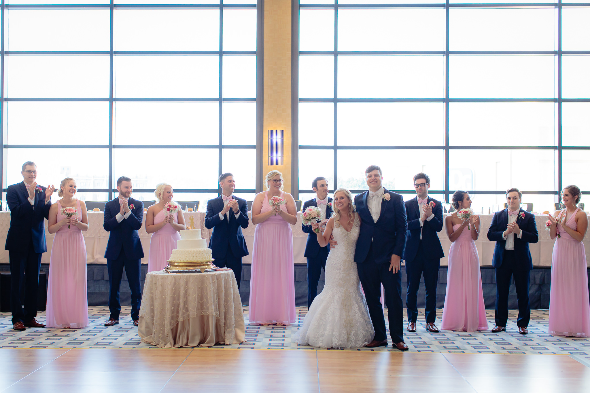 Bridal party applauds the newlyweds at a Duquesne University wedding reception