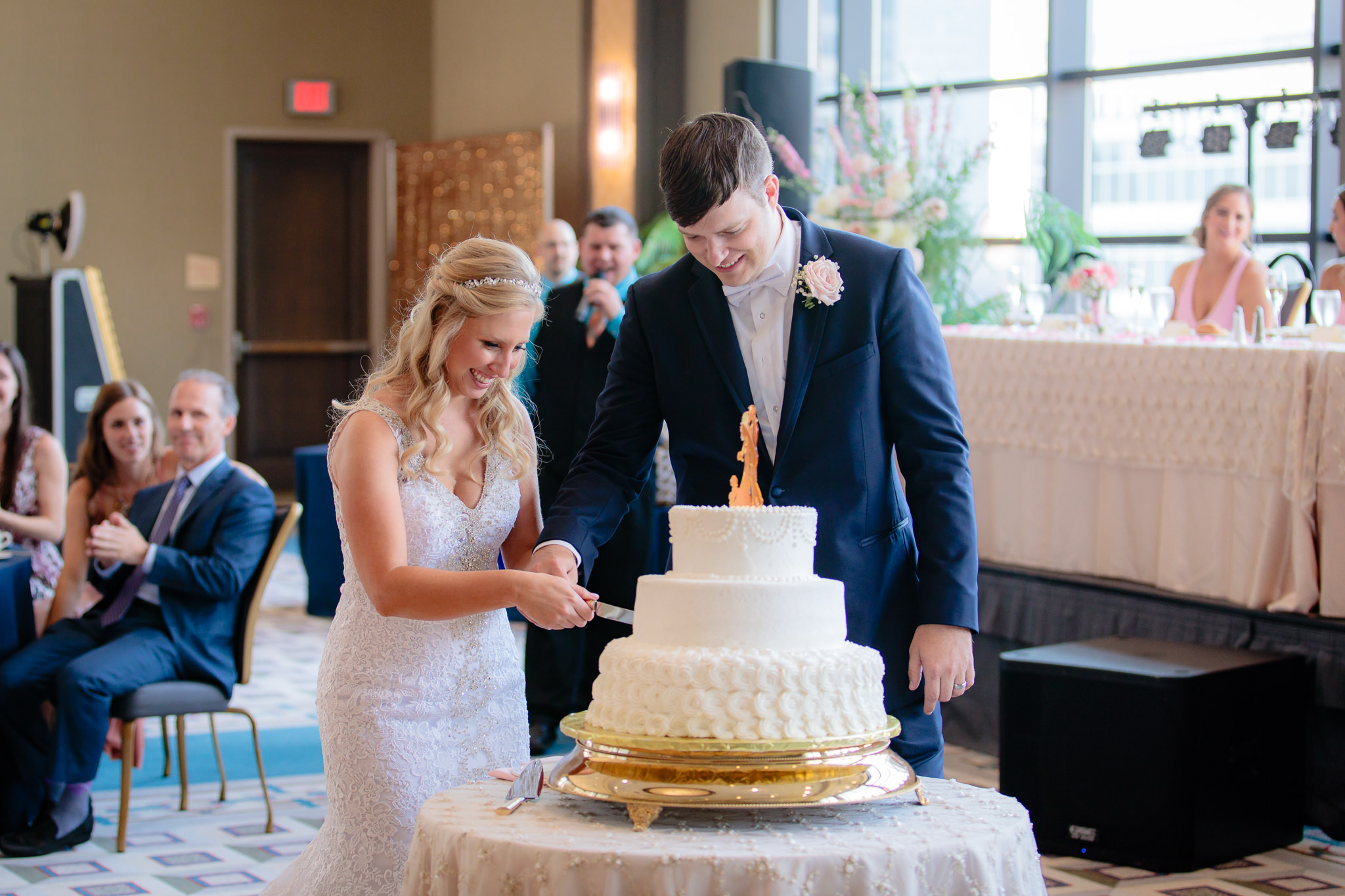 Newlyweds cut the cake at their Duquesne University wedding