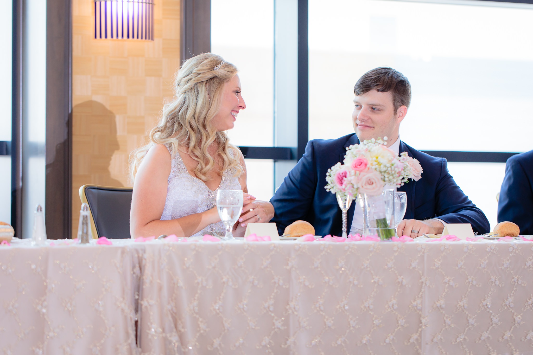 Newlyweds laugh during speeches at their Duquesne University wedding