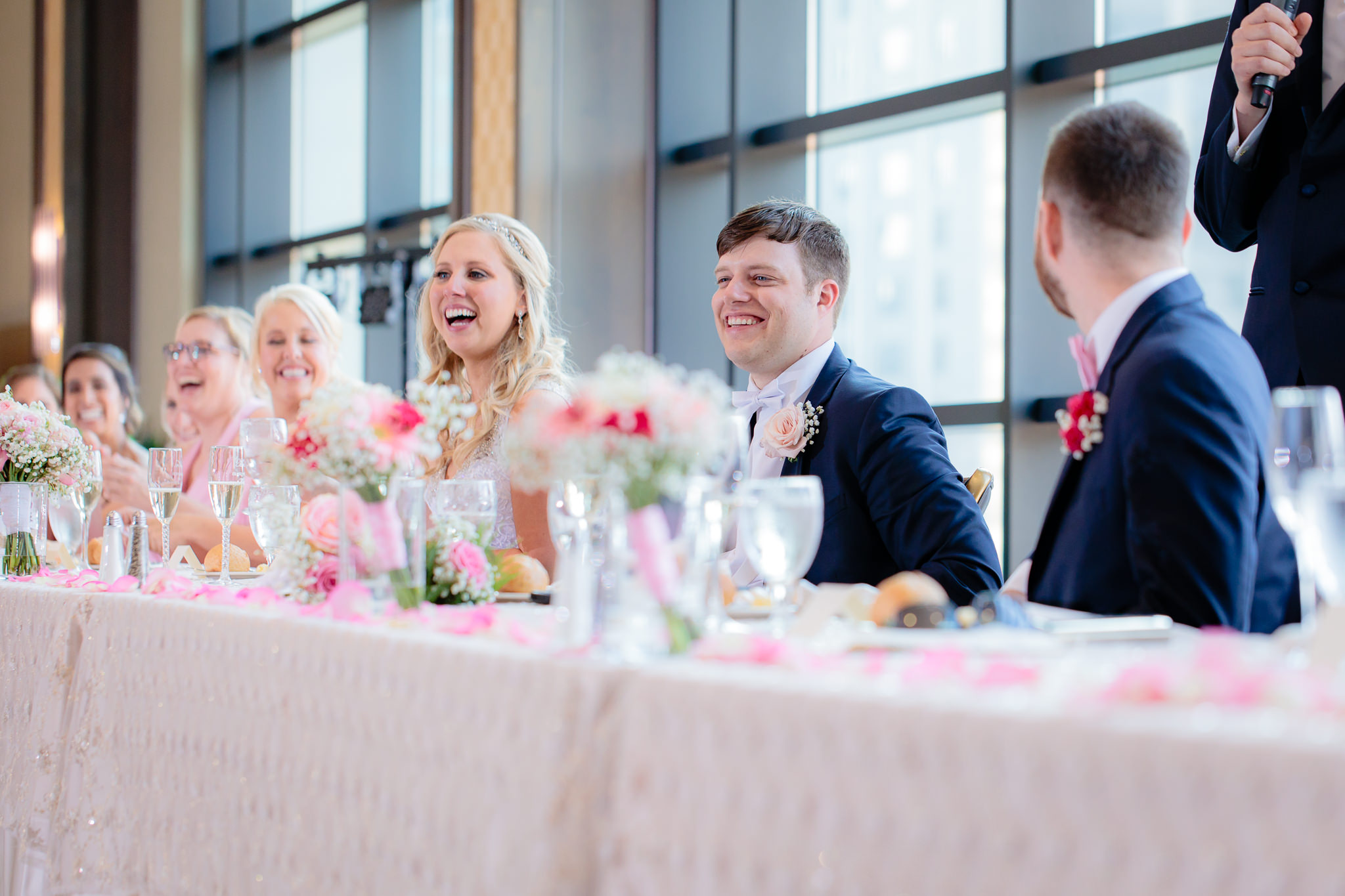 Bridal party laughs during speeches at Duquesne University
