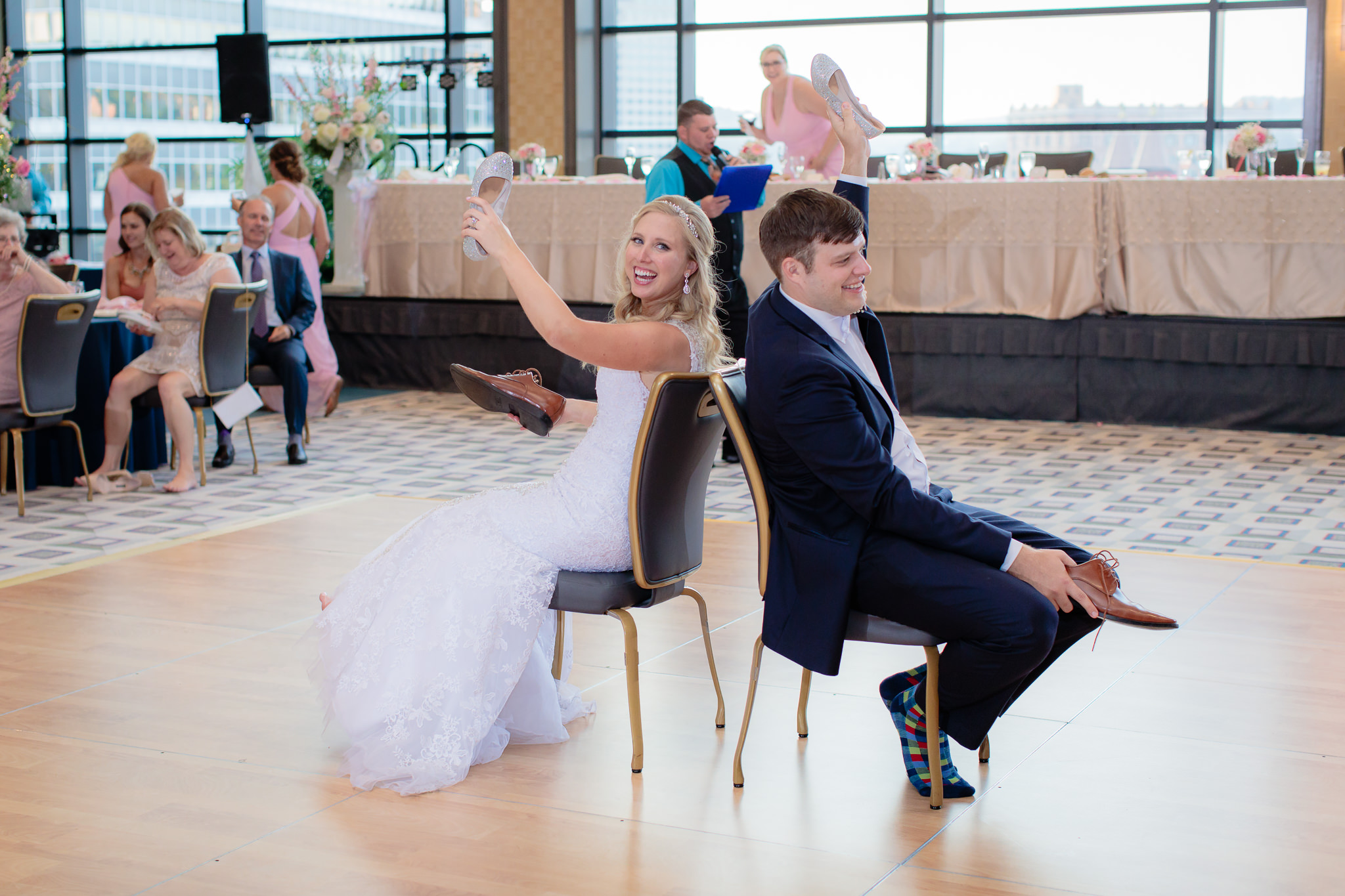 Newlyweds play the shoe game at their Duquesne University wedding reception