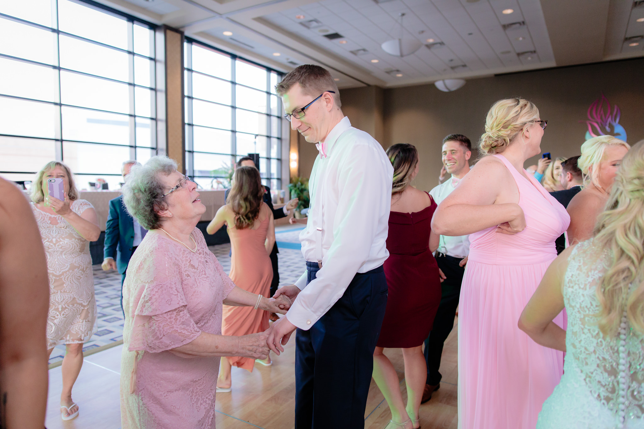 Groomsman dances with his grandmother at Duquesne University