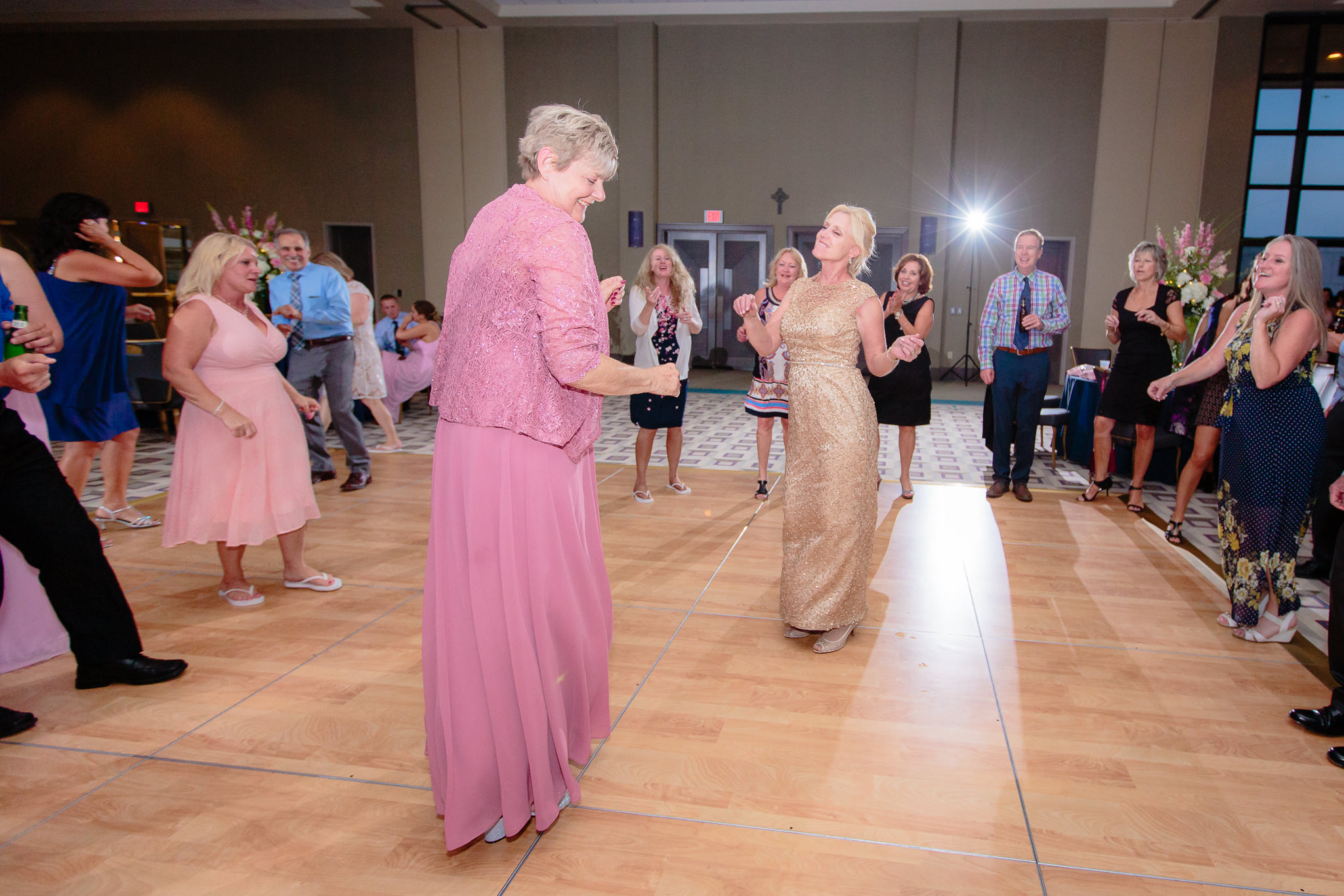 Mothers of the bride & groom dance together at a Duquesne University wedding reception