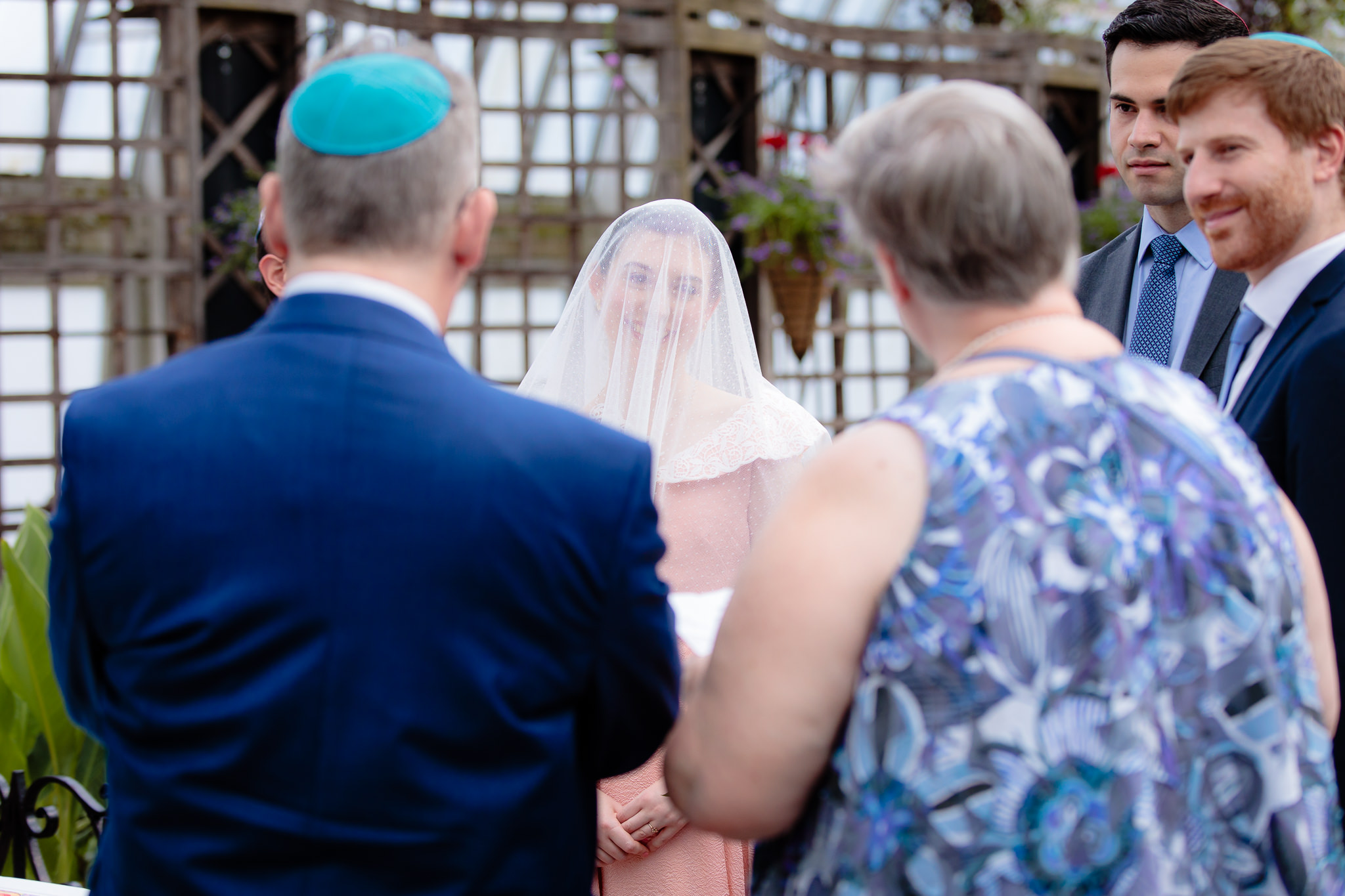 Bride smiles at her parents after the Ketubah signing at Phipps Conservatory