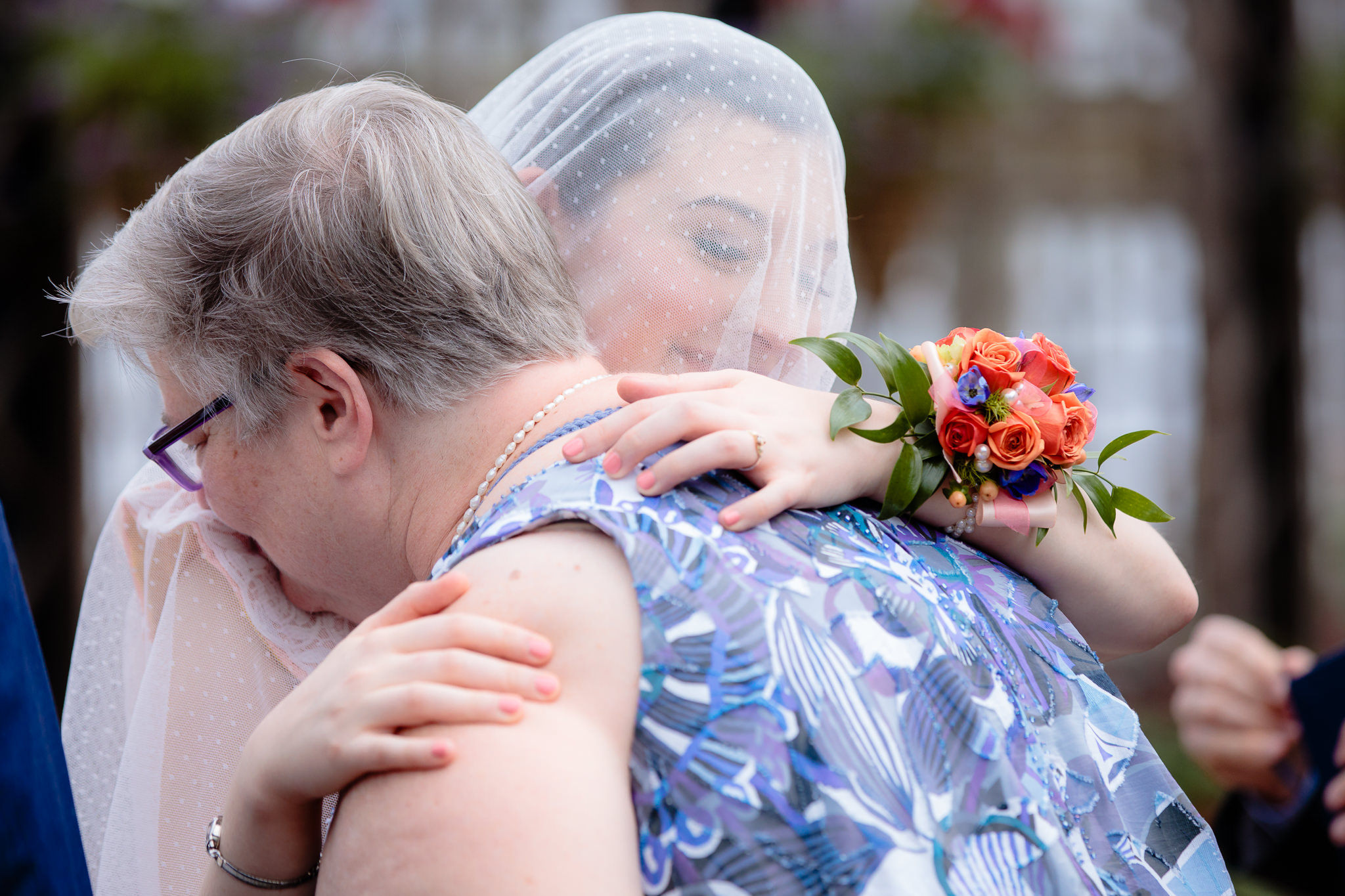 Bride hugs her mom after the Ketubah signing at Phipps Conservatory