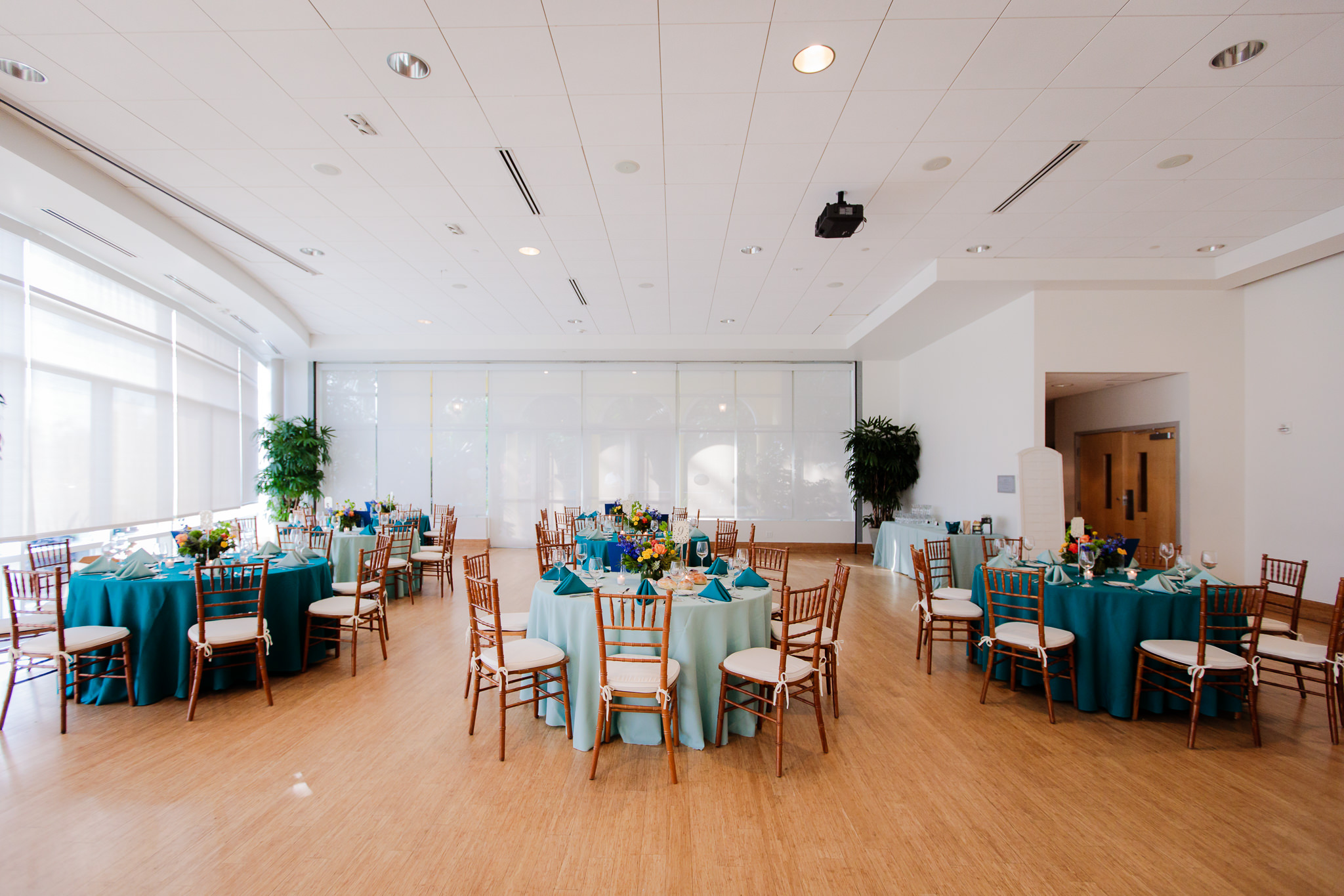 Phipps Conservatory's special events hall decorated for a colorful summer wedding